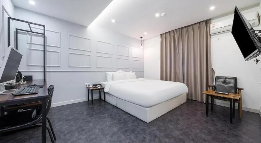 Bed in Gray Hotel