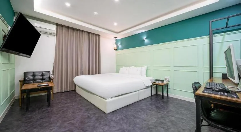Bed in Gray Hotel