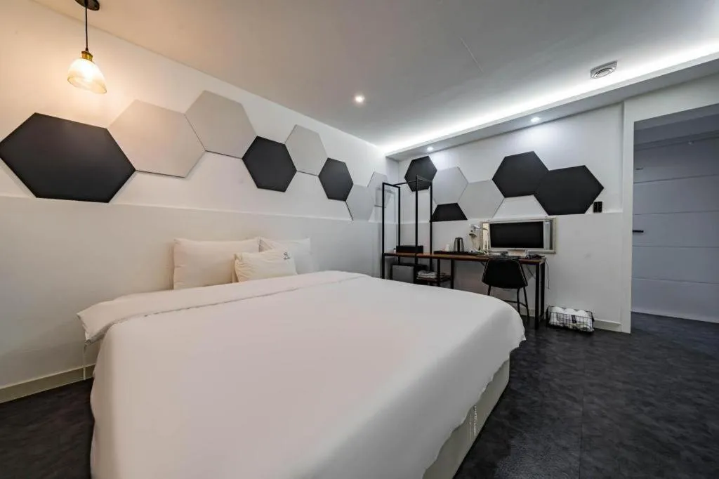 Bed in Gray Hotel
