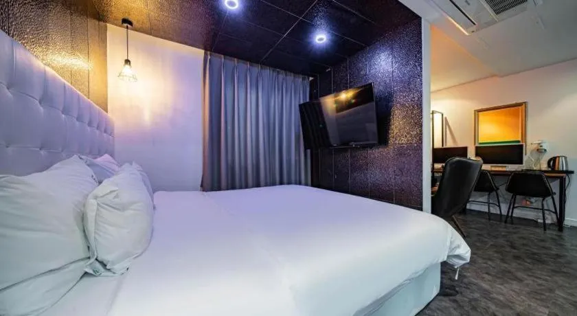 Bed in Gray Hotel