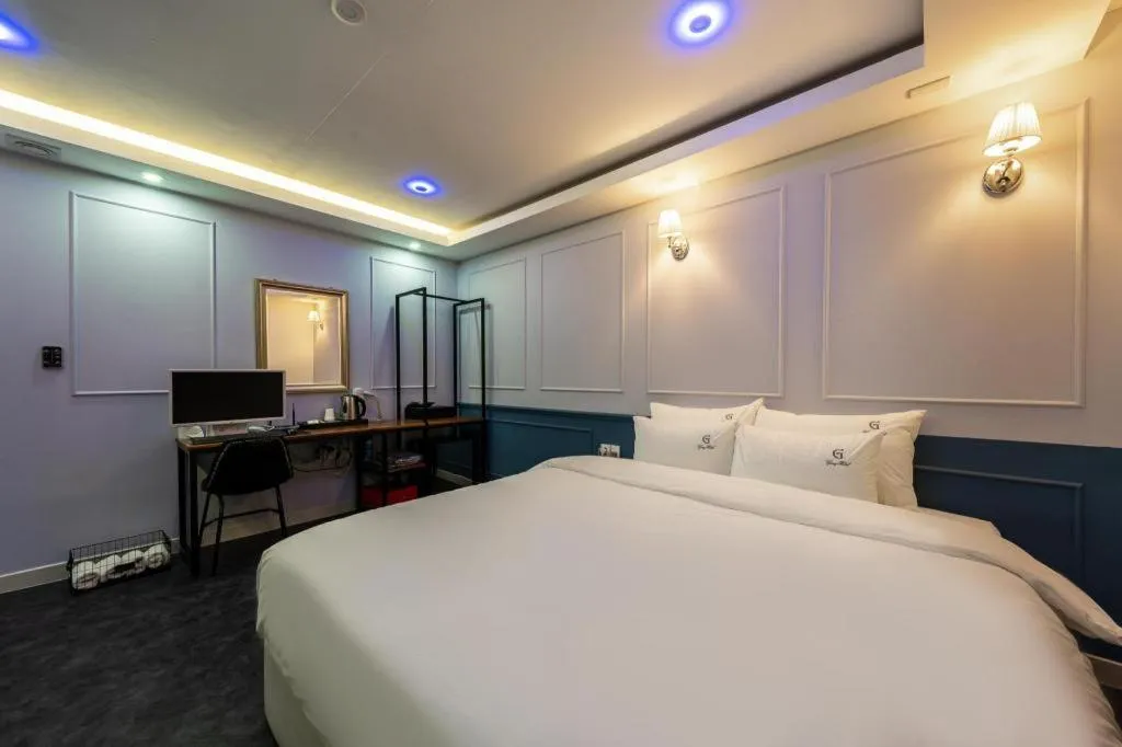 Bed in Gray Hotel