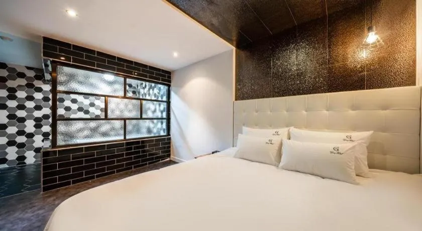 Bed in Gray Hotel