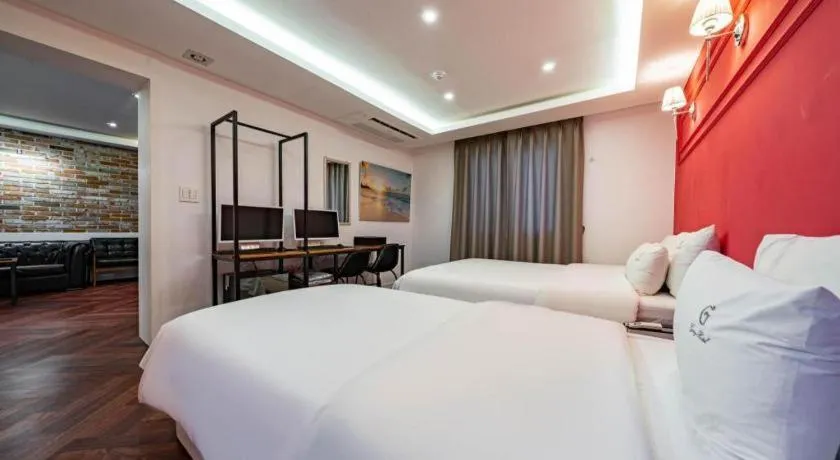 Bed in Gray Hotel