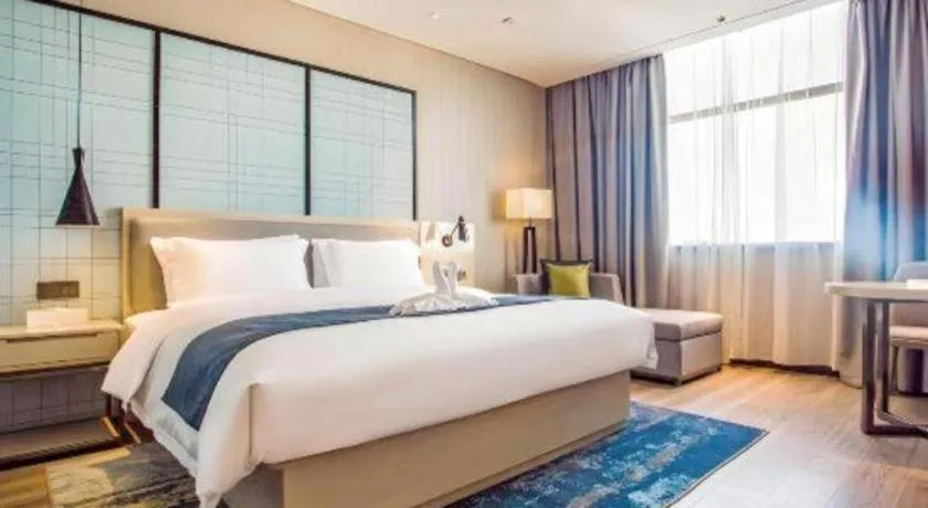 Bed in Echarm Hotel Qionghai Wanquan River