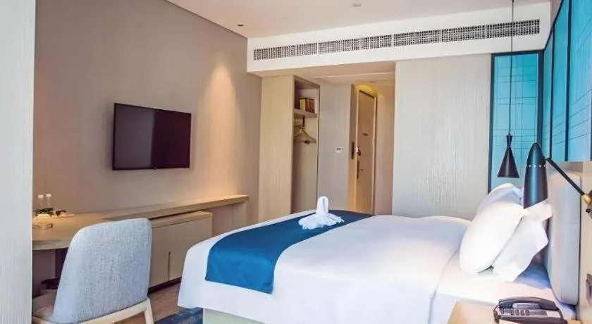 Bed in Echarm Hotel Qionghai Wanquan River