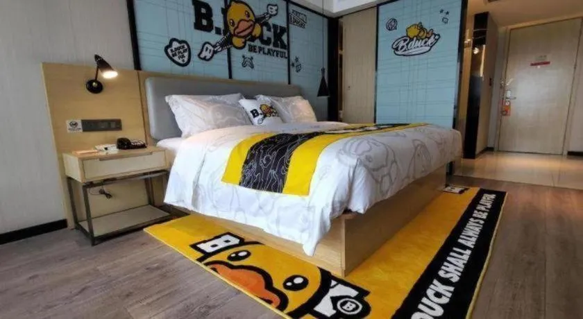 Bed in Echarm Hotel Qionghai Wanquan River