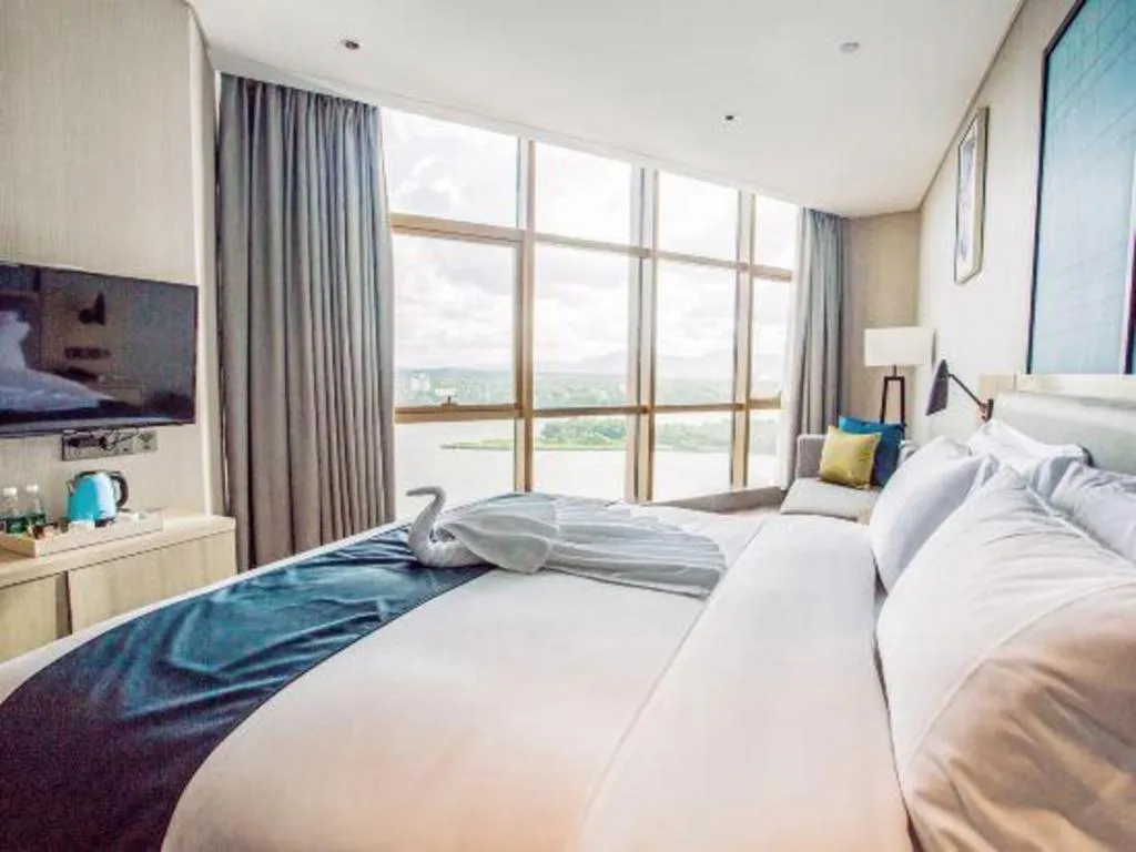 Bed in Echarm Hotel Qionghai Wanquan River