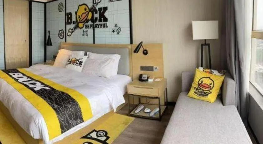 Bed in Echarm Hotel Qionghai Wanquan River