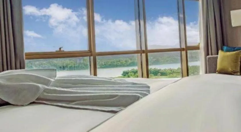 Bed in Echarm Hotel Qionghai Wanquan River