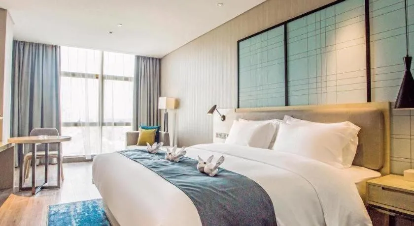 Bed in Echarm Hotel Qionghai Wanquan River