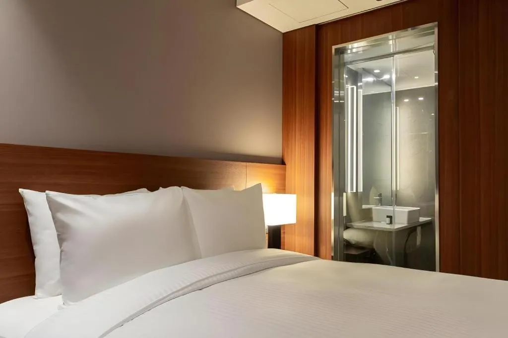 Bed in Top Cloud Hotel Iksan