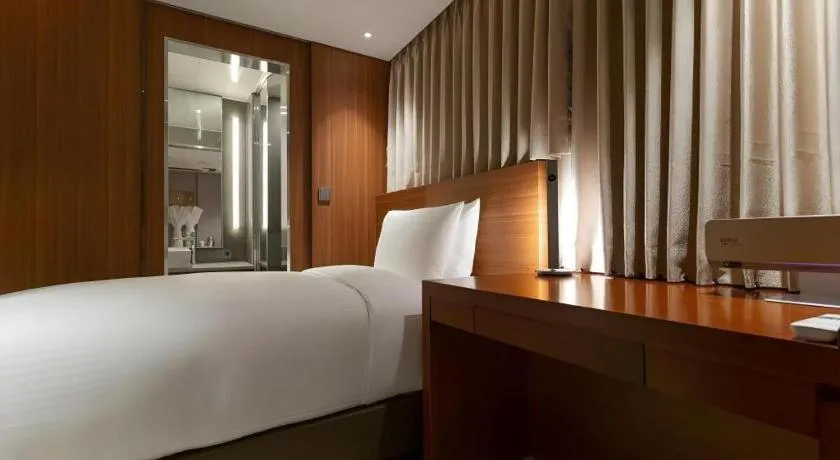 Bed in Top Cloud Hotel Iksan