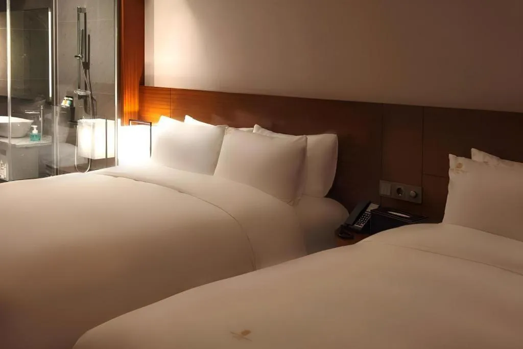 Bed in Top Cloud Hotel Iksan