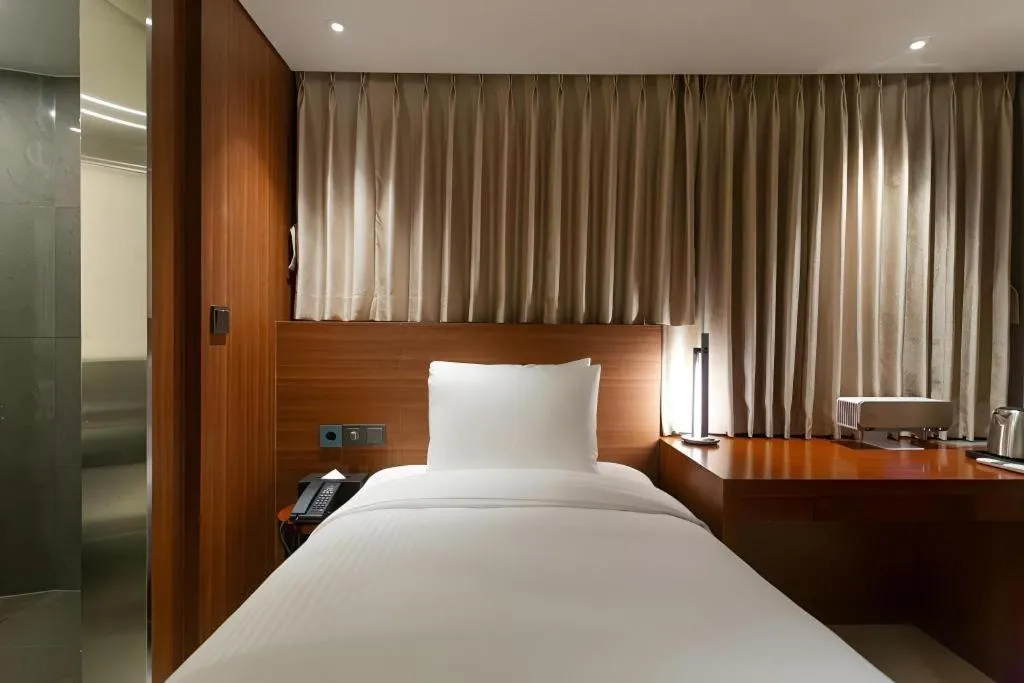 Bed in Top Cloud Hotel Iksan