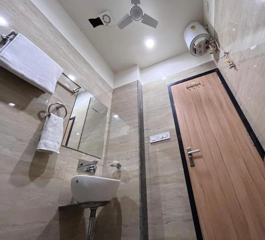 Bathroom in Hotel Rajvi Residency A Unit Of Jas Hotels And Resorts