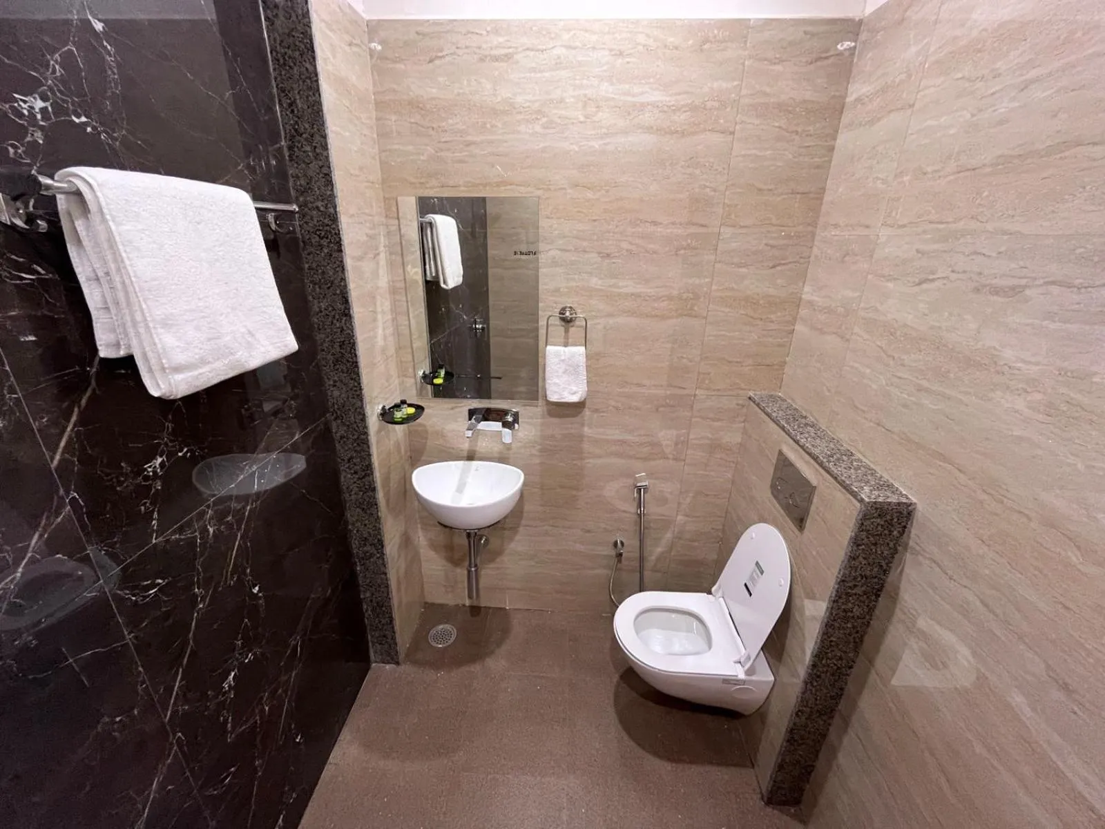 Bathroom in Hotel Rajvi Residency A Unit Of Jas Hotels And Resorts