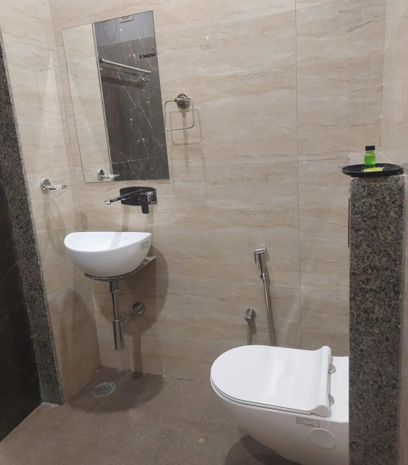Bathroom in Hotel Rajvi Residency A Unit Of Jas Hotels And Resorts