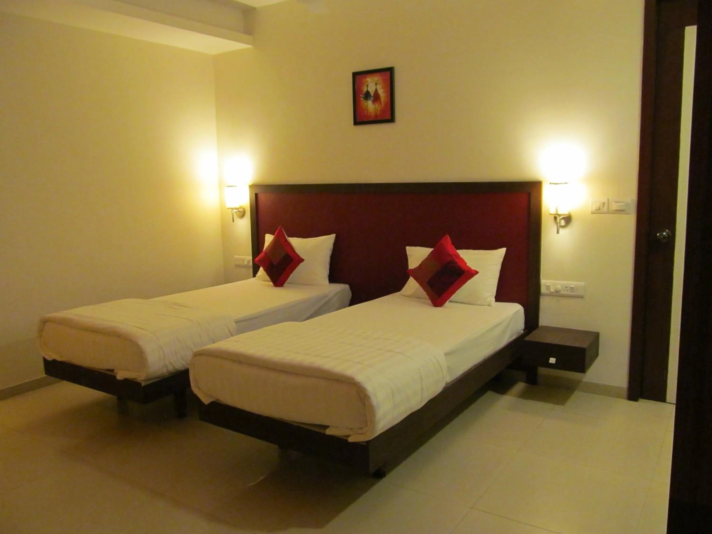 Bed in Ixora Suites