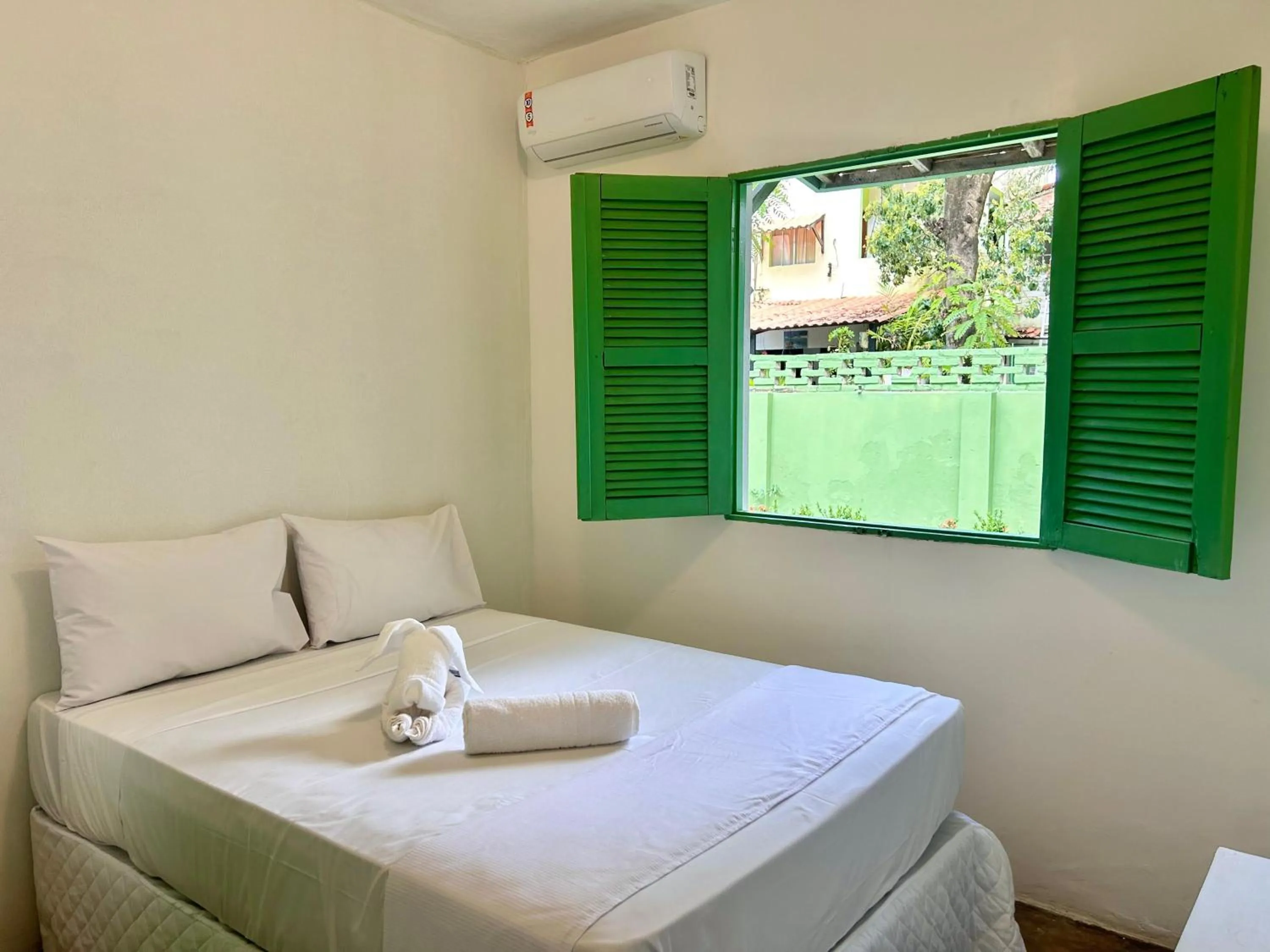 Bed in Pousada Maracaju