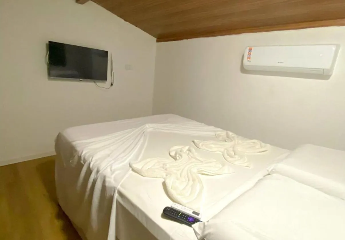 Bed in Pousada Maracaju