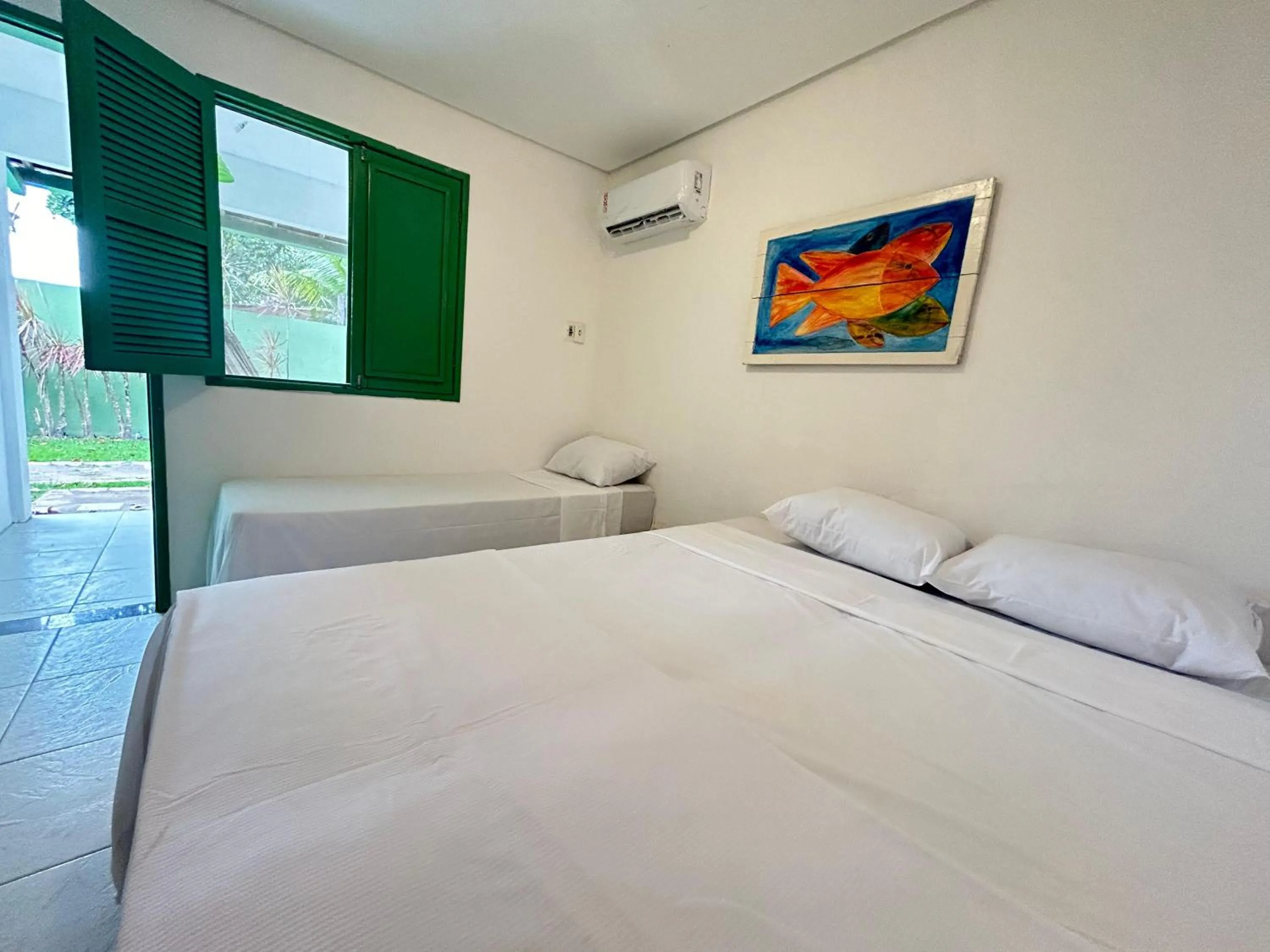 Bed in Pousada Maracaju