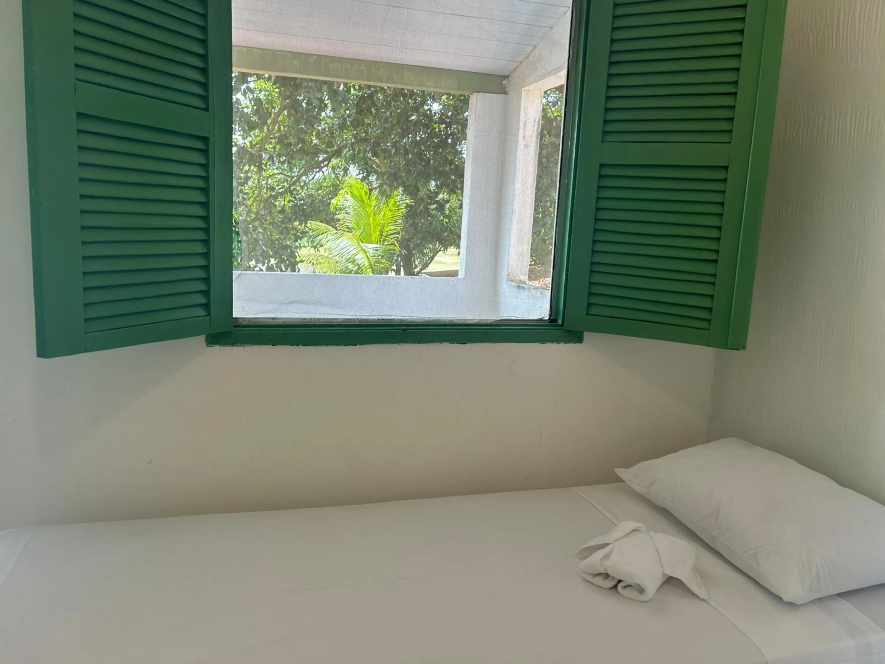 Bed in Pousada Maracaju