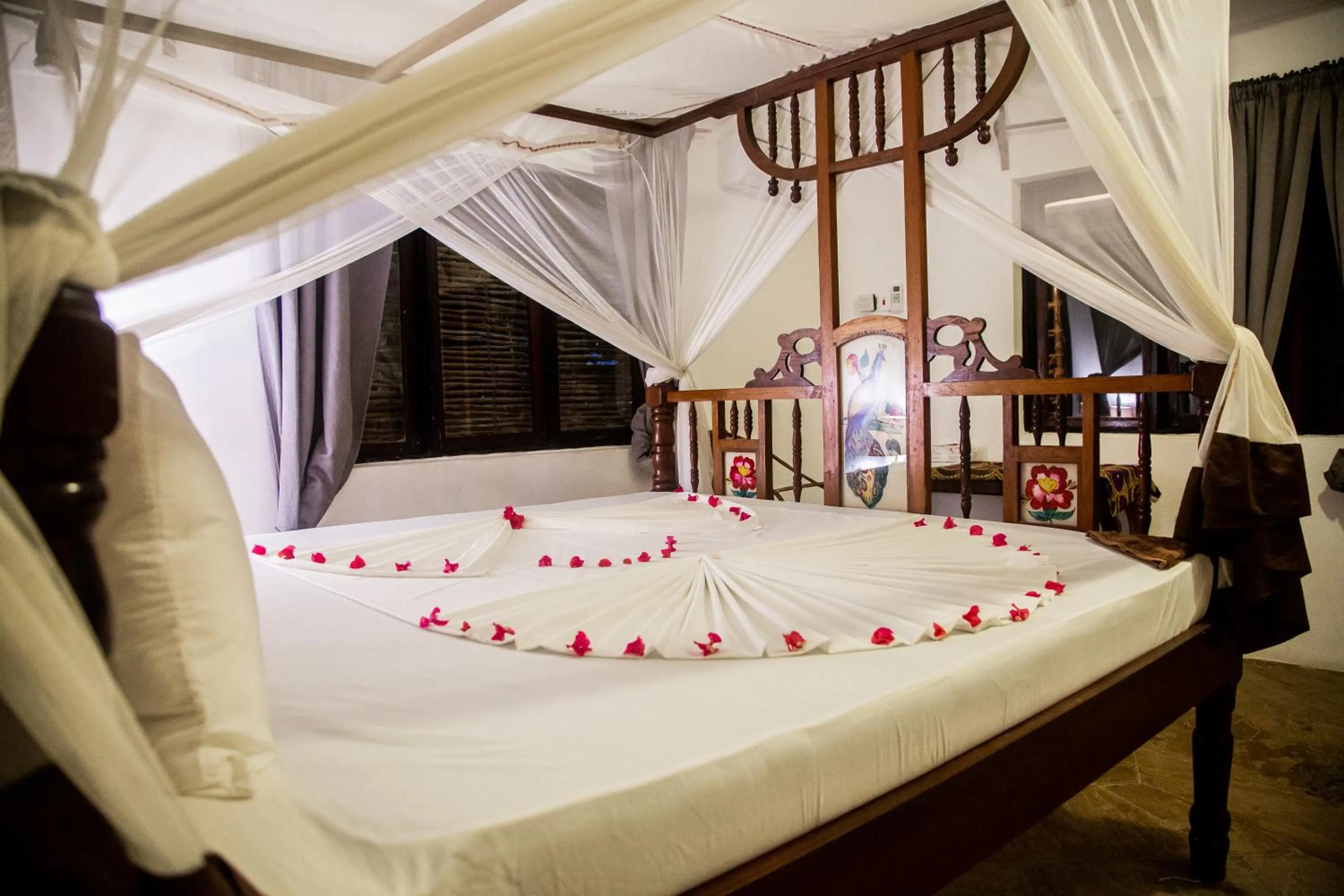 Bed in Moonshine Uroa Boutique Hotel