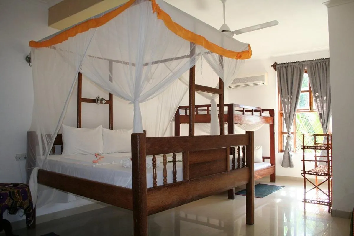 Bed in Moonshine Uroa Boutique Hotel