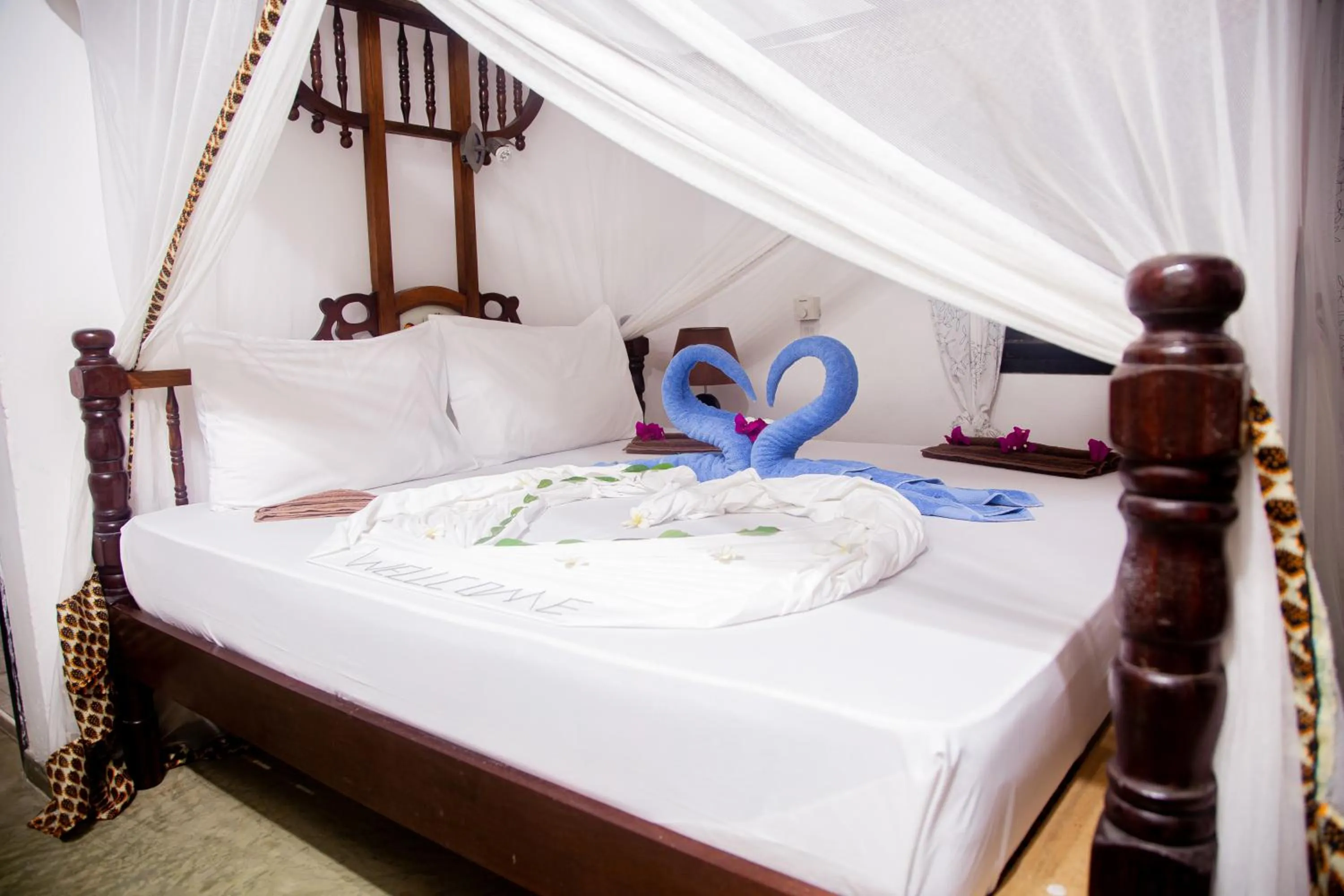 Bed in Moonshine Uroa Boutique Hotel