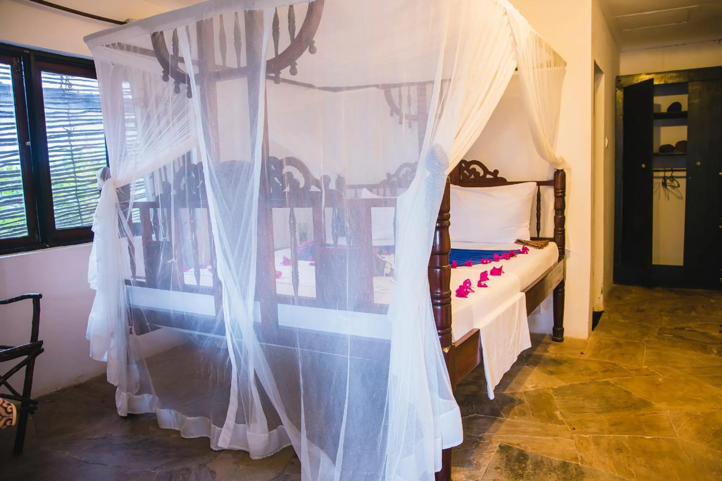 Bed in Moonshine Uroa Boutique Hotel