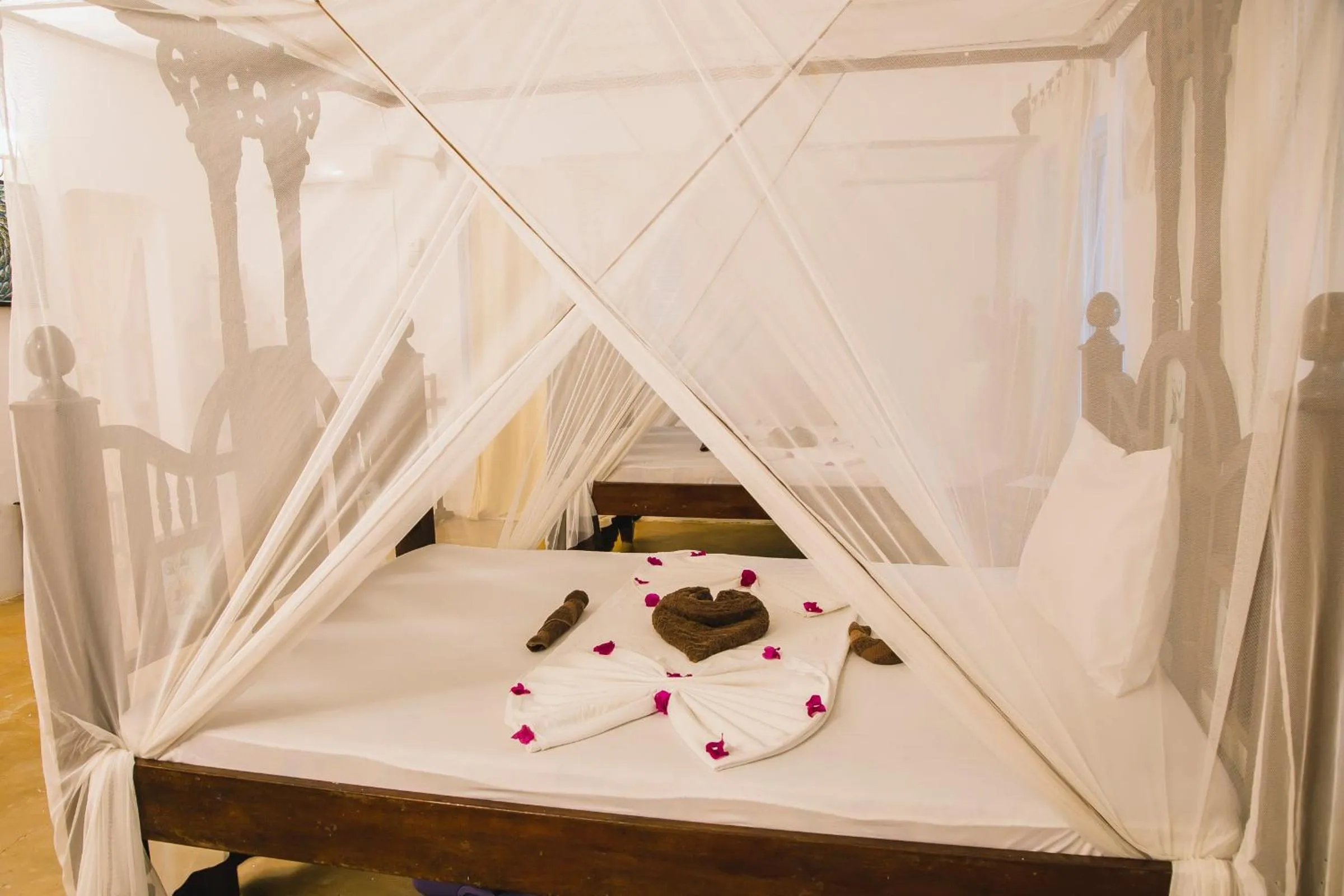 Bed in Moonshine Uroa Boutique Hotel