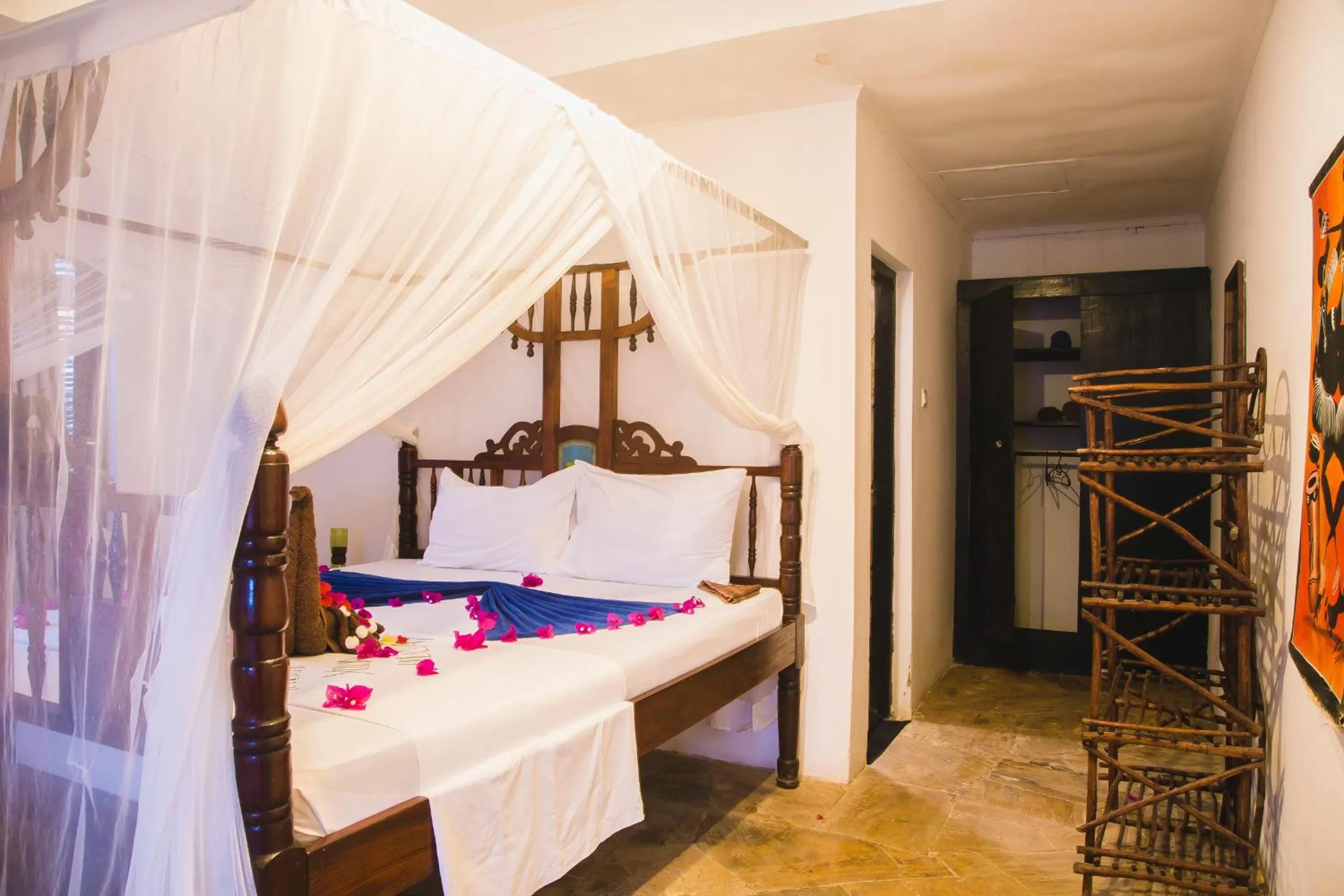 Bed in Moonshine Uroa Boutique Hotel