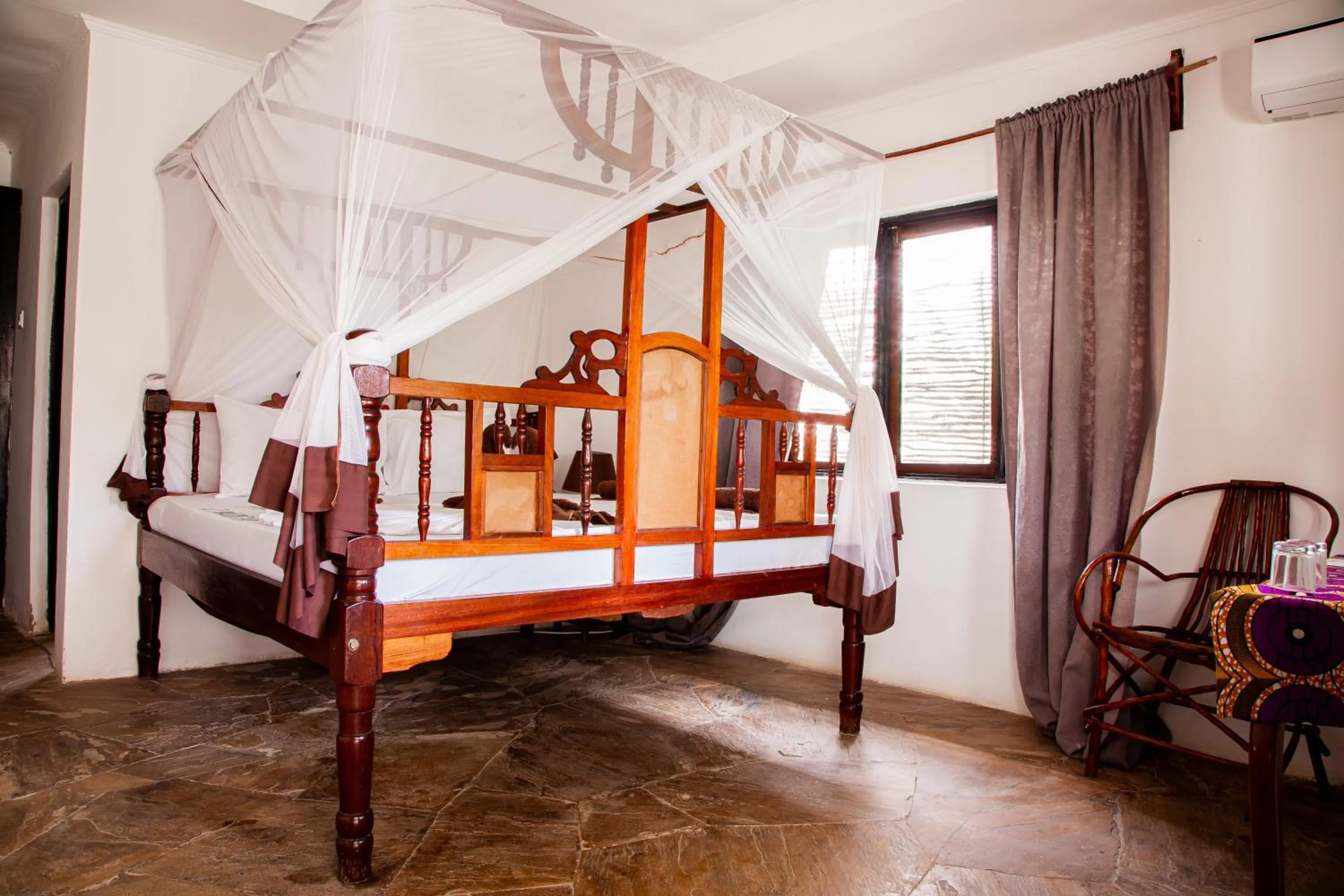 Bed in Moonshine Uroa Boutique Hotel