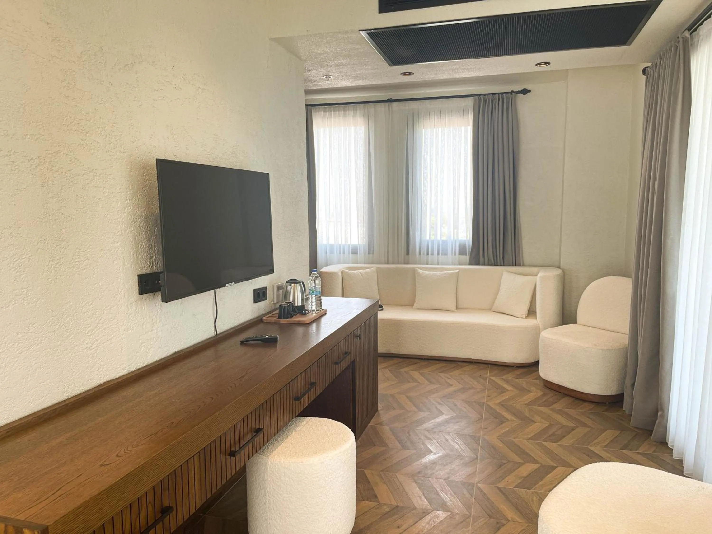 Communal lounge/ TV room in Now Boutique Hotel