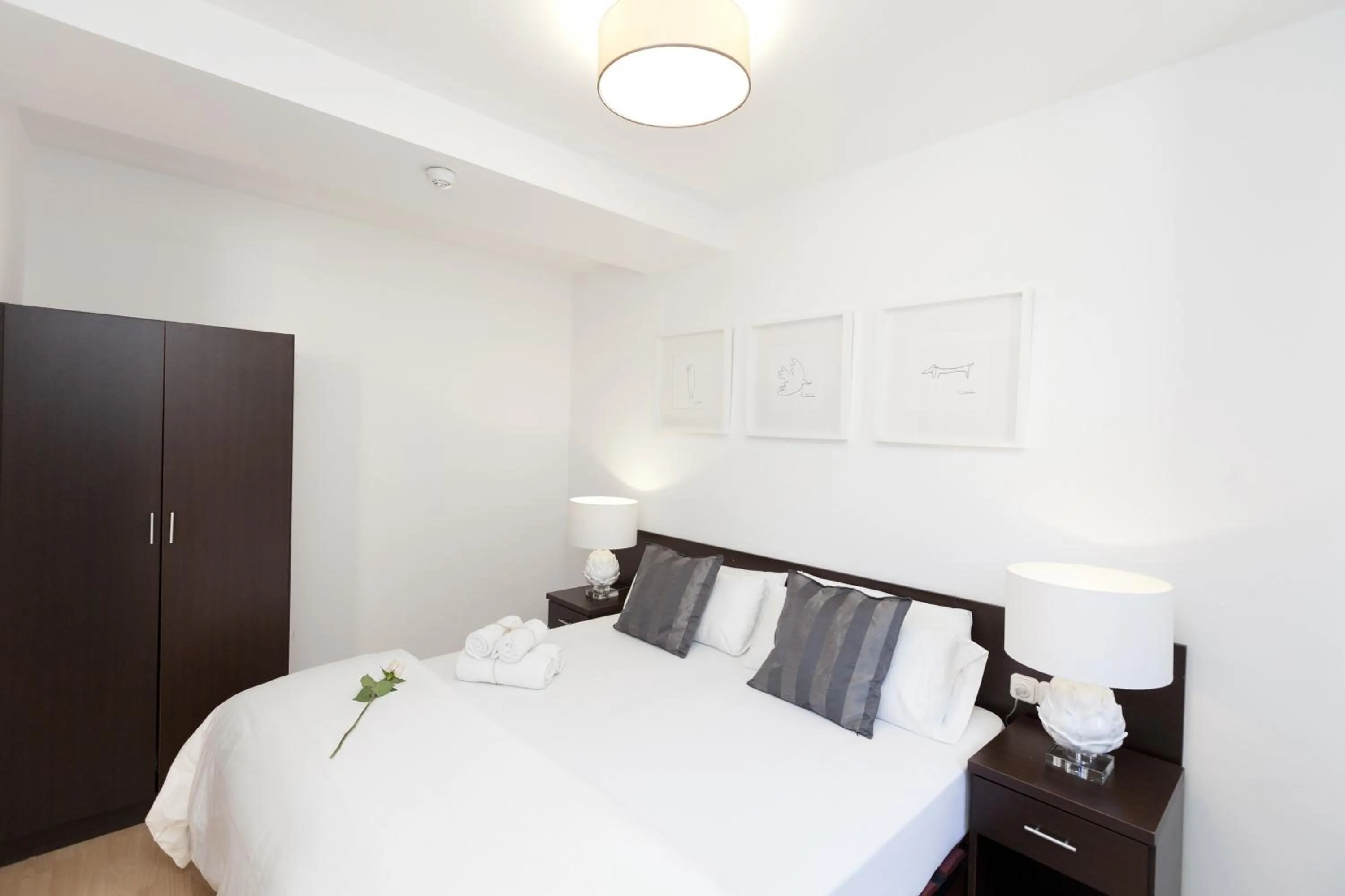 Bed in Happy Apartments