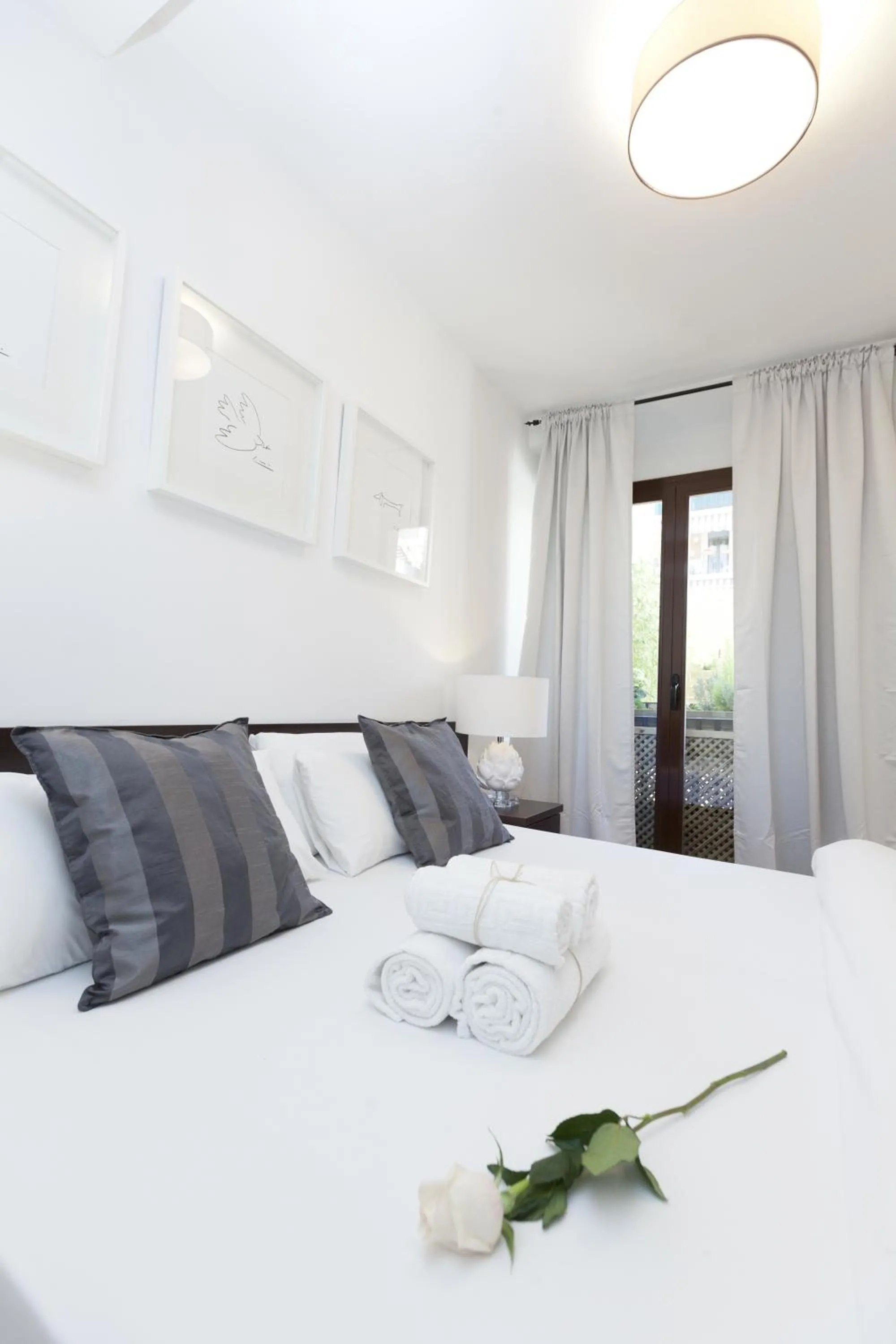 Bed in Happy Apartments