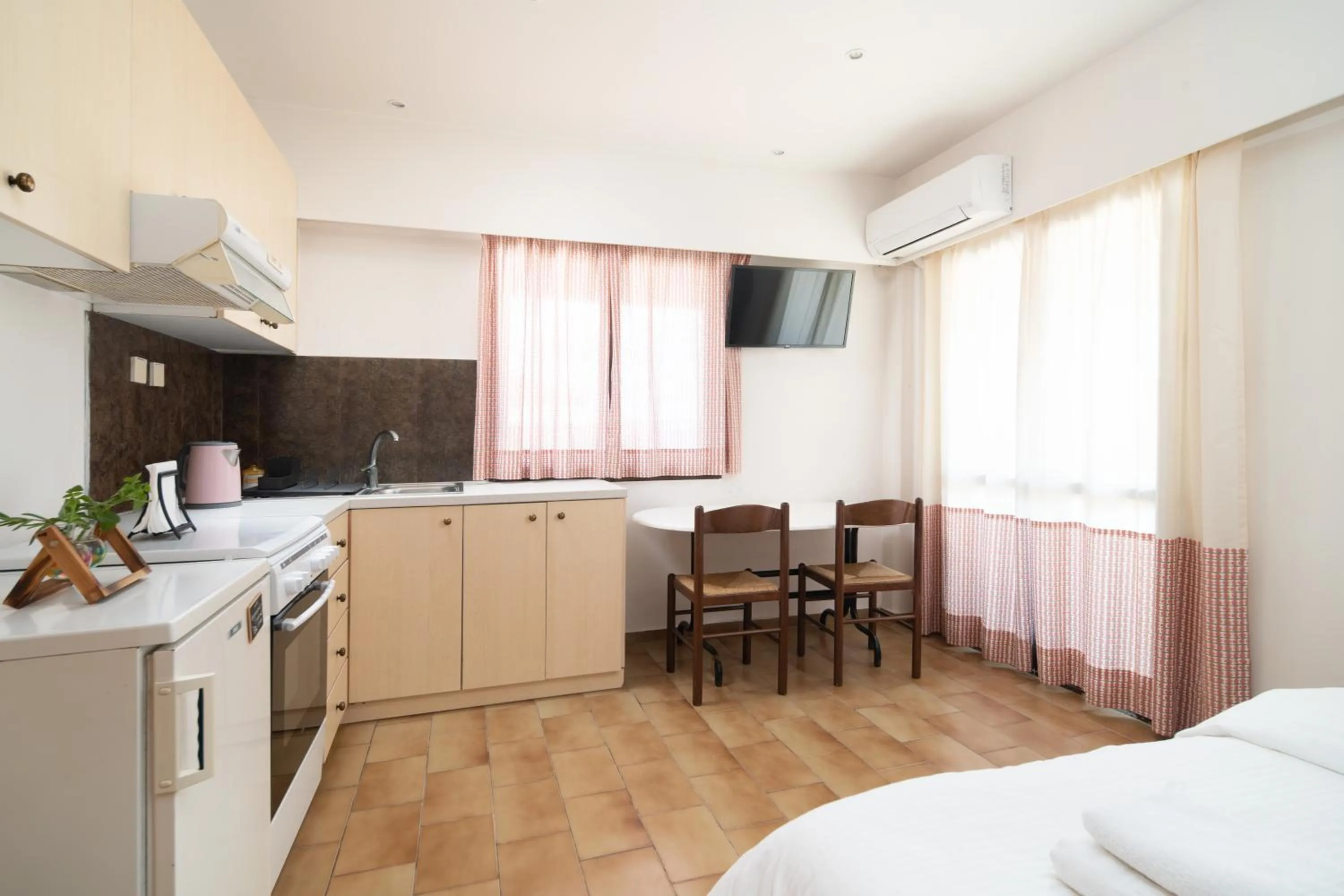 Dining area, Bed in Monemvasia Green Apartments