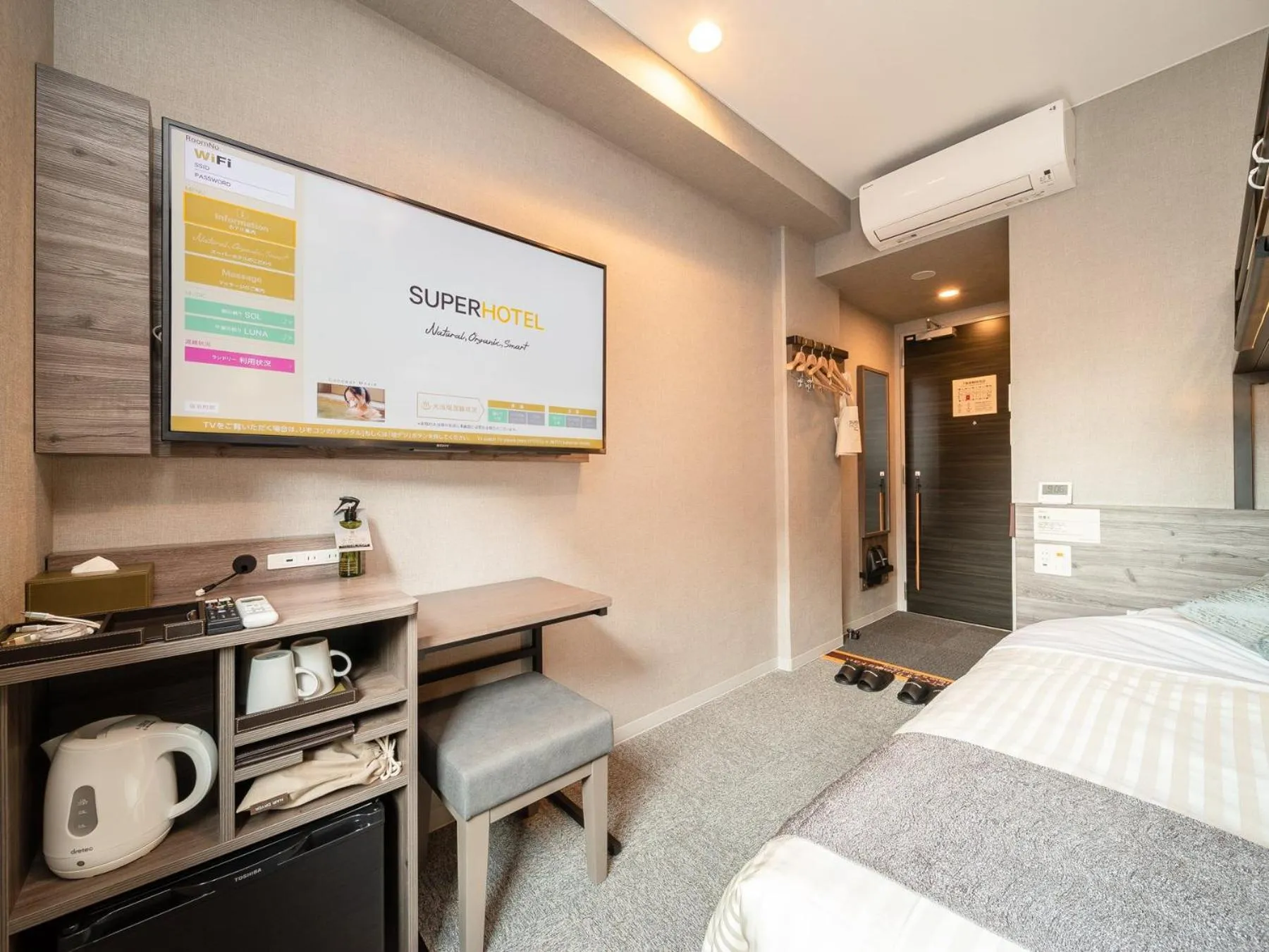 Bed in Super Hotel Premier Nagoya Sakuradoriguchi