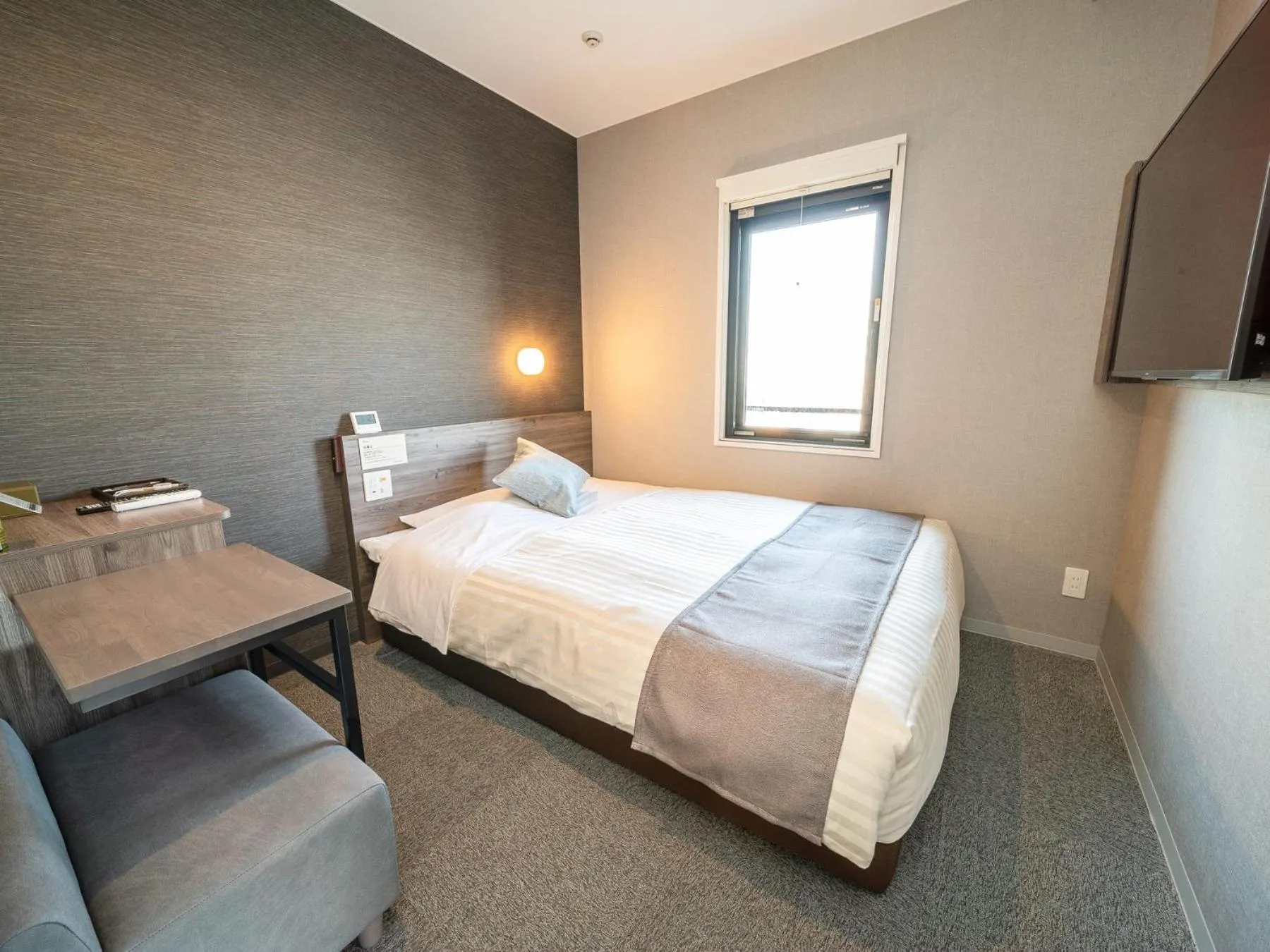 Bed in Super Hotel Premier Nagoya Sakuradoriguchi