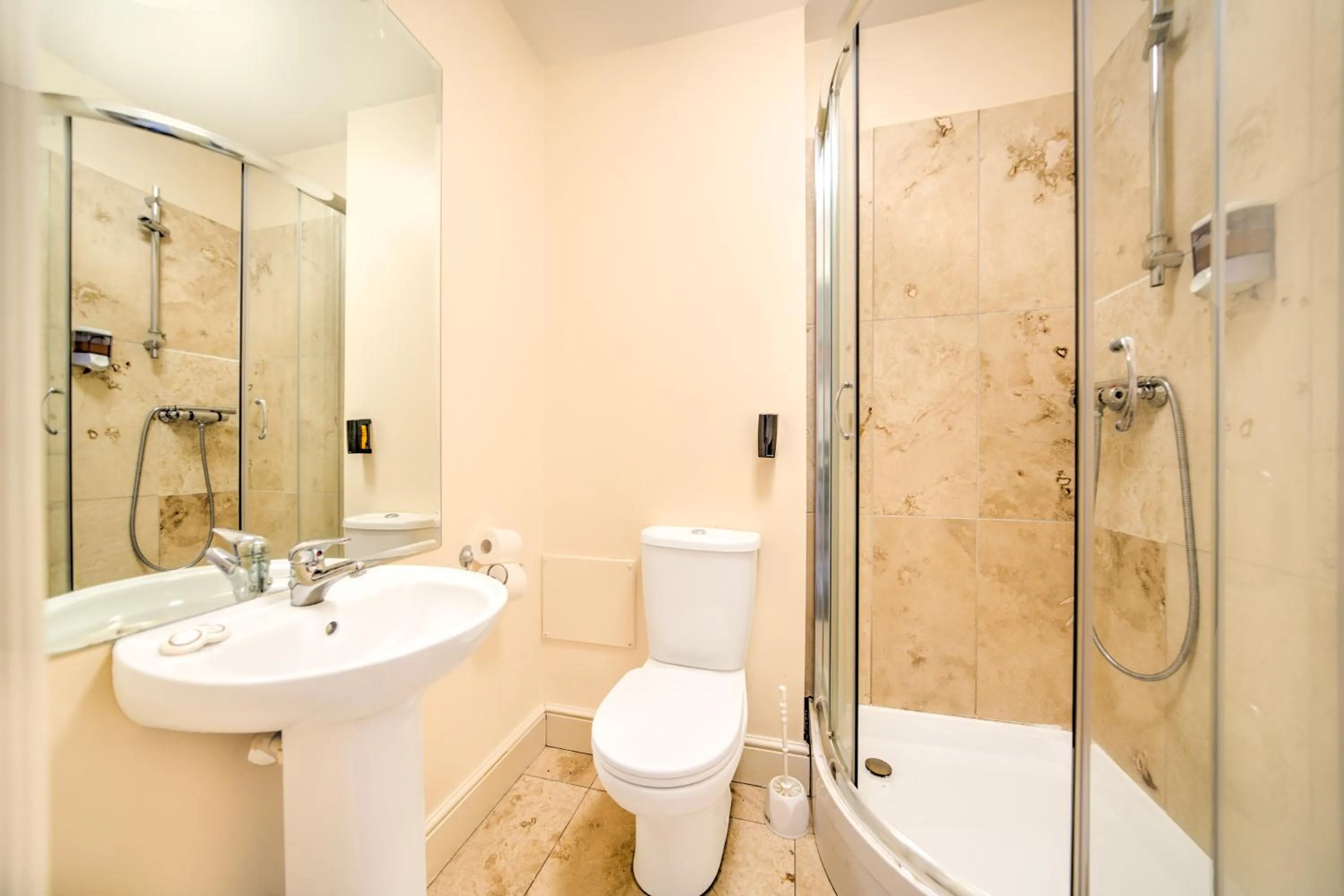 Bathroom in GO2 Gloucester Hotel by OYO