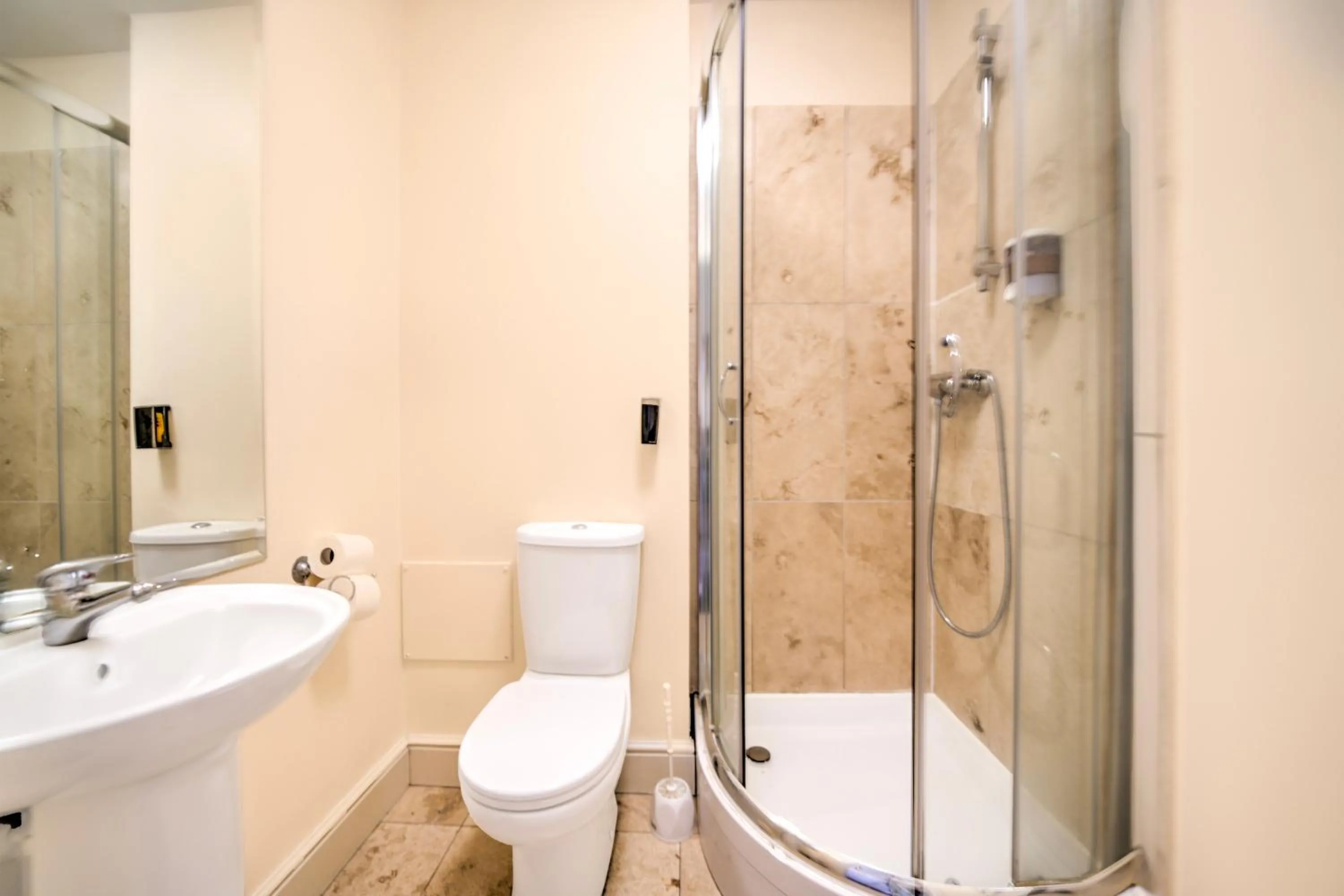 Bathroom in GO2 Gloucester Hotel by OYO