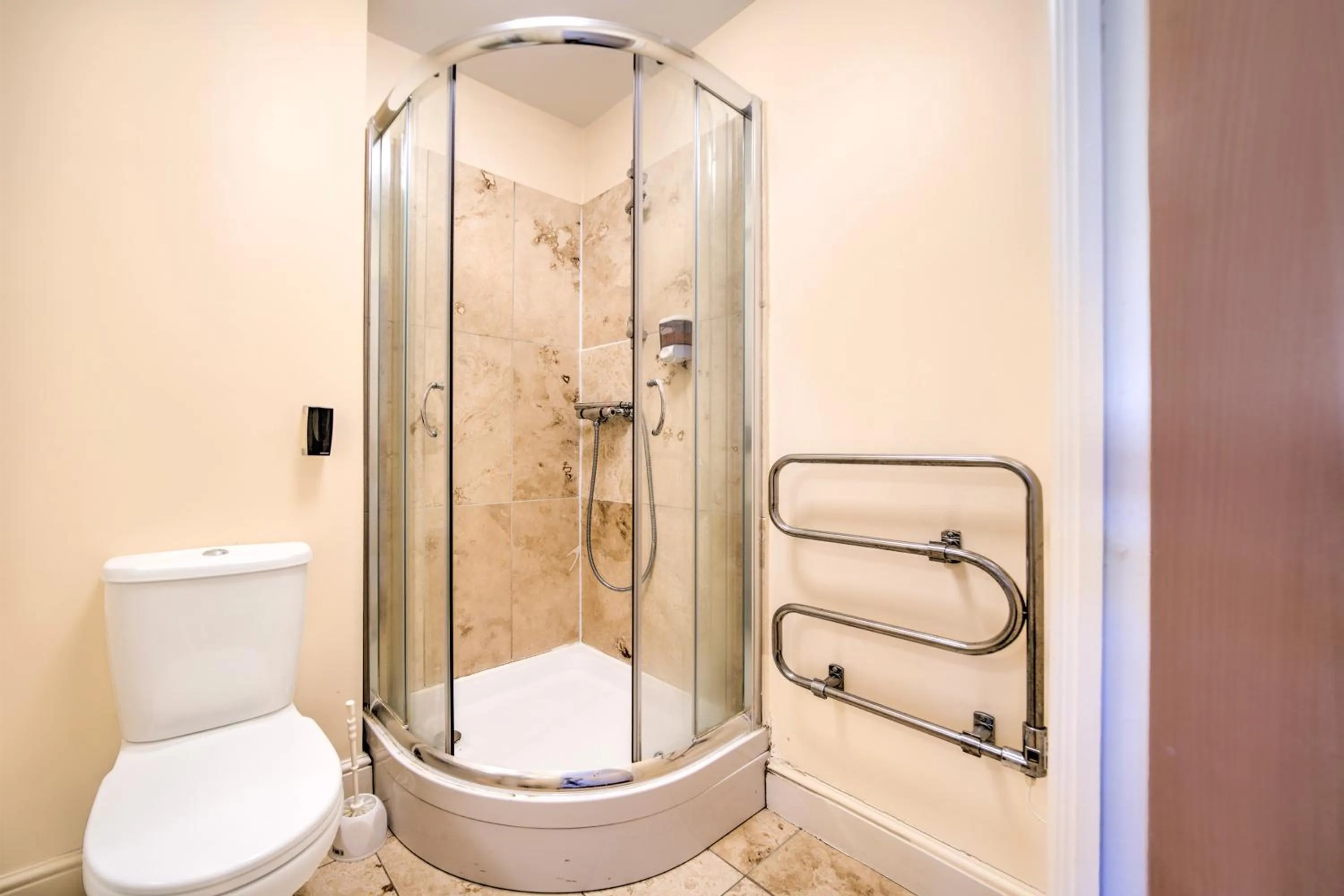 Bathroom in GO2 Gloucester Hotel by OYO