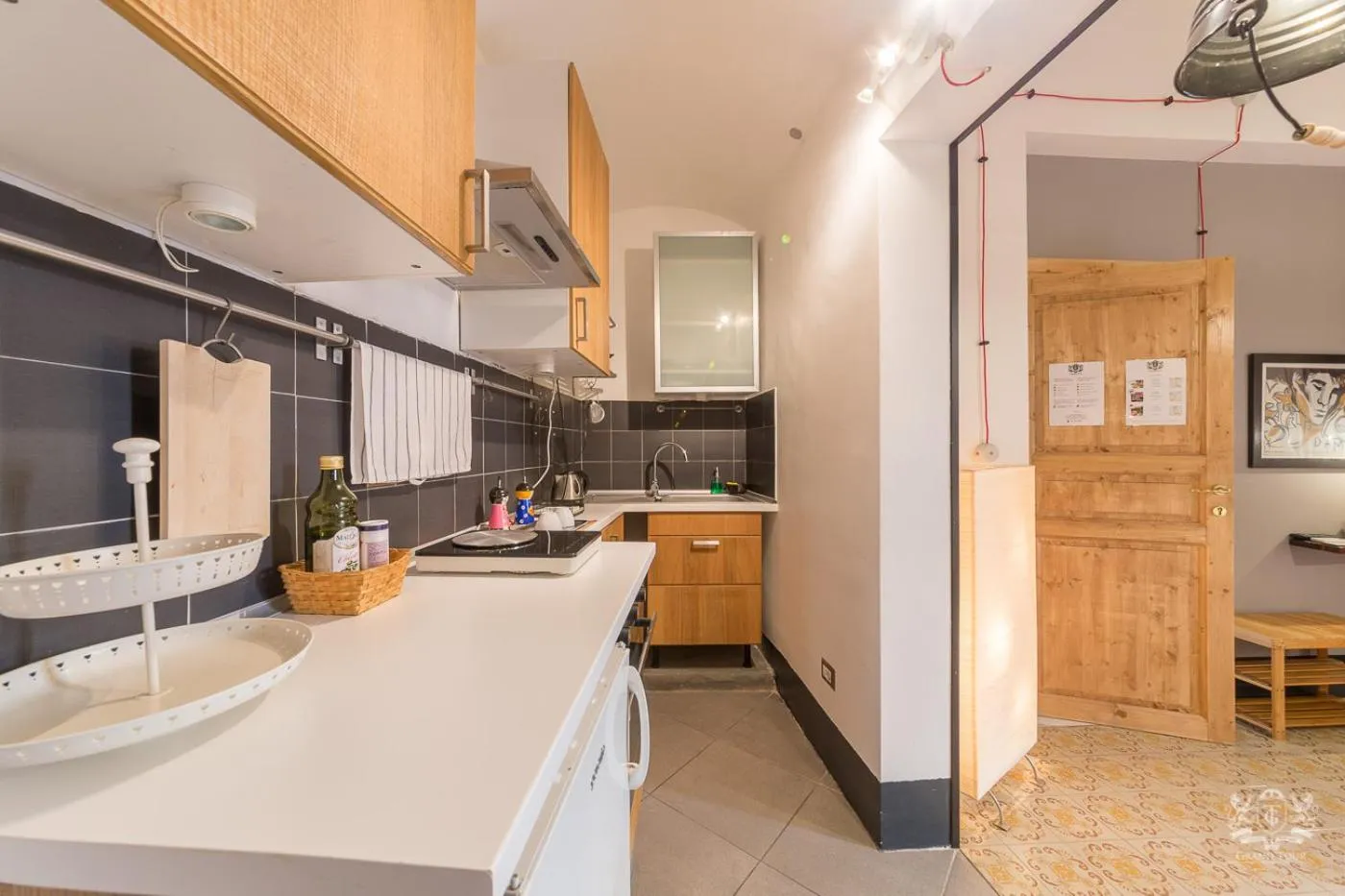 Kitchen or kitchenette in Grand Tour Design Guest House Catania Self Check-in