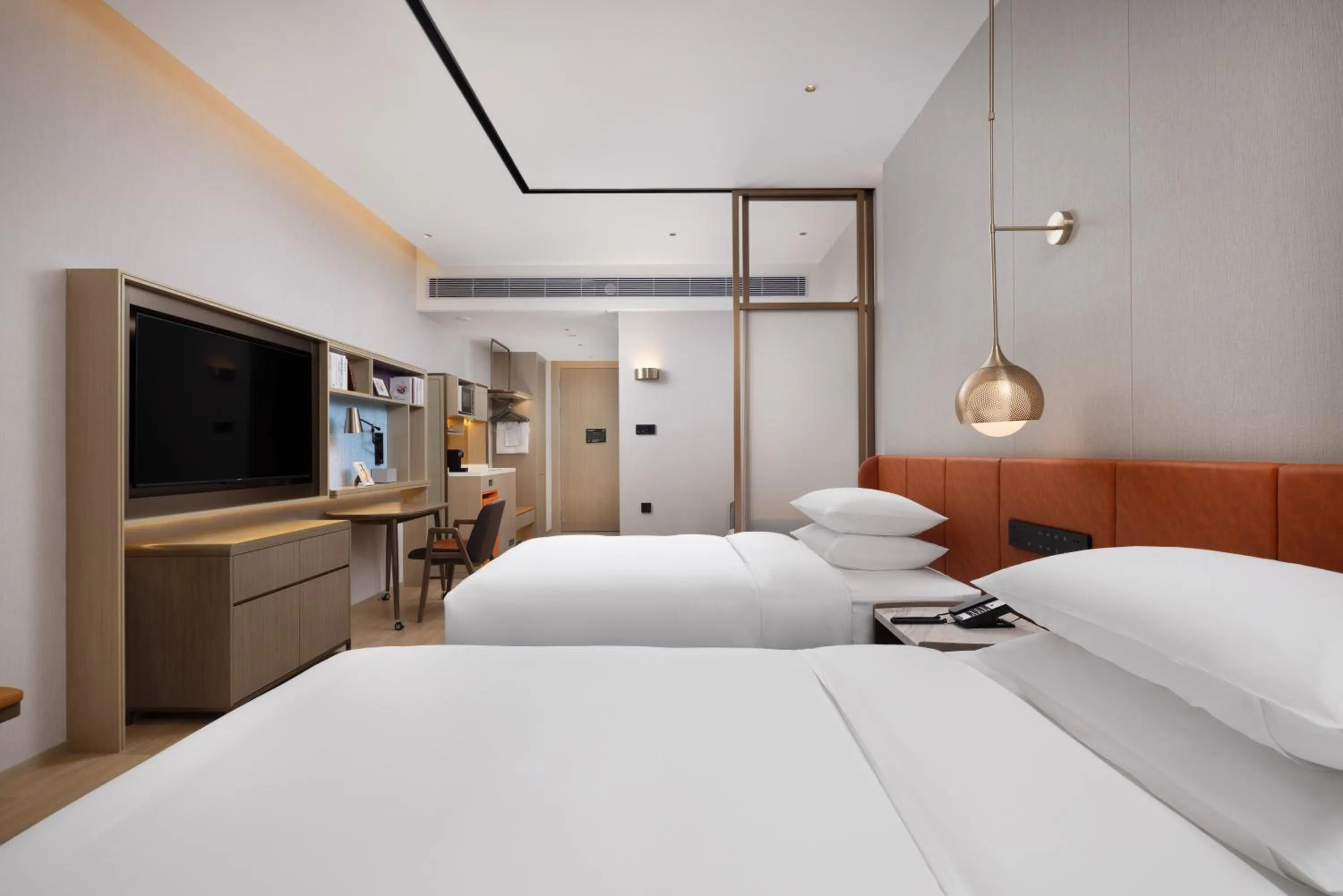 Bed in Home2 Suite by Hilton Dongguan Shipai