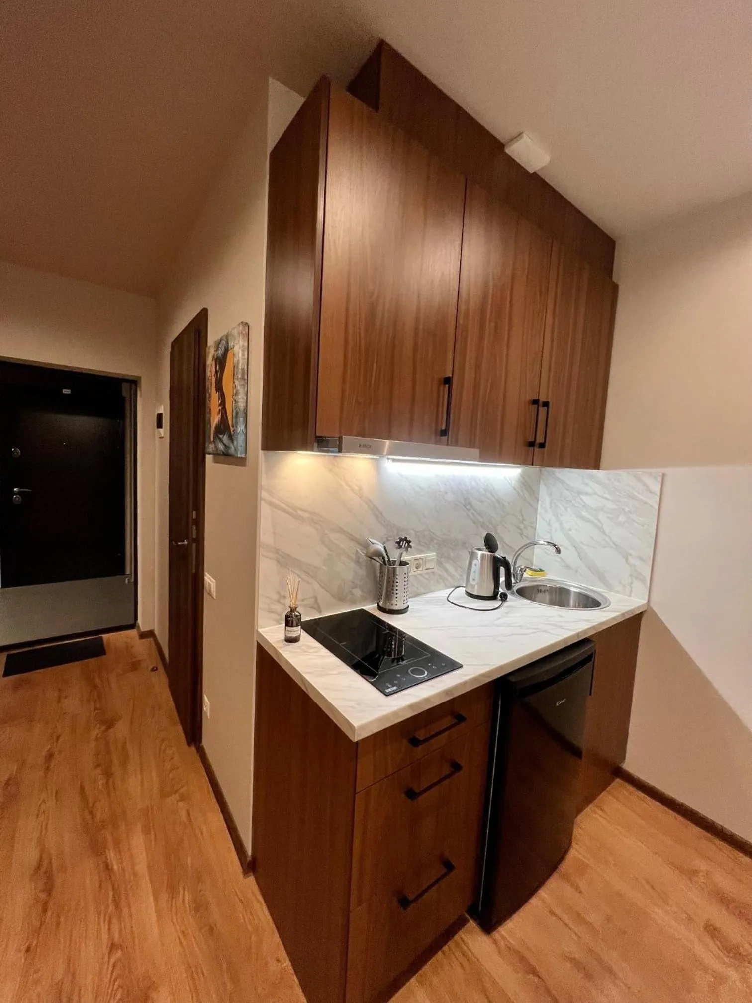 Kitchen or kitchenette in RVR Smart Apartments Riga with Free Parking and Self Check-in