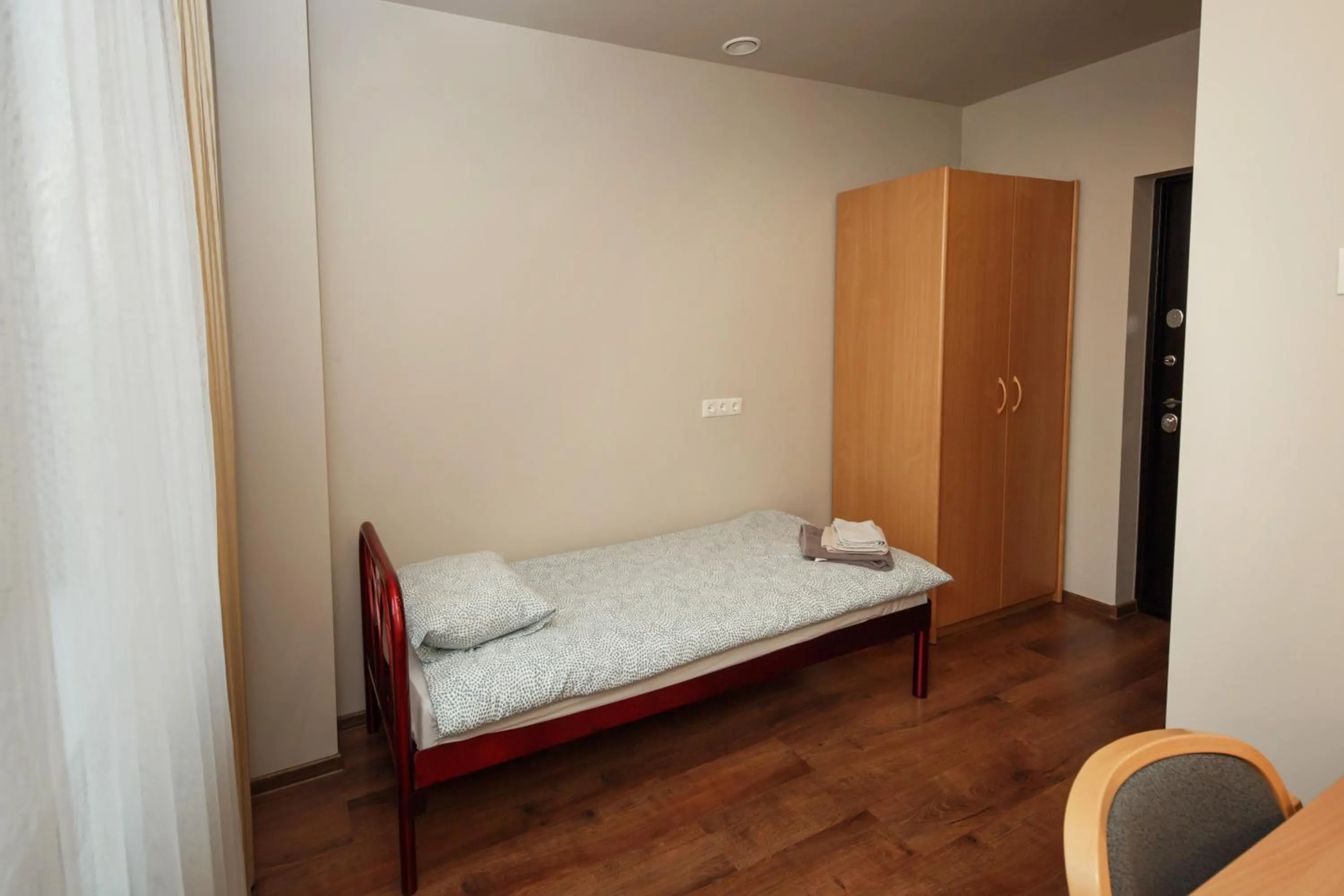 wardrobe, Bed in RVR Smart Apartments Riga with Free Parking and Self Check-in