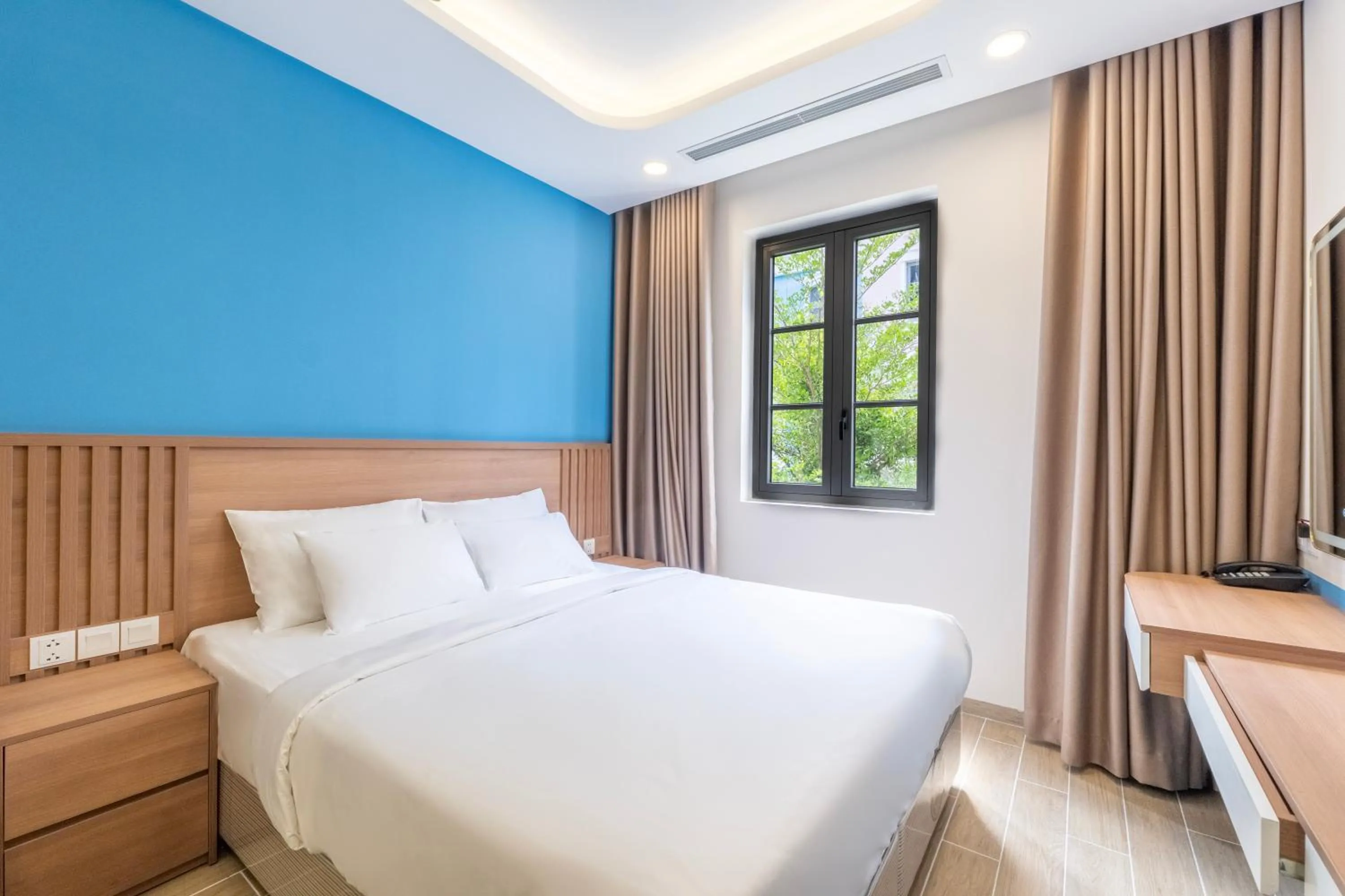 Bed in HL Melody Boutique Hotel