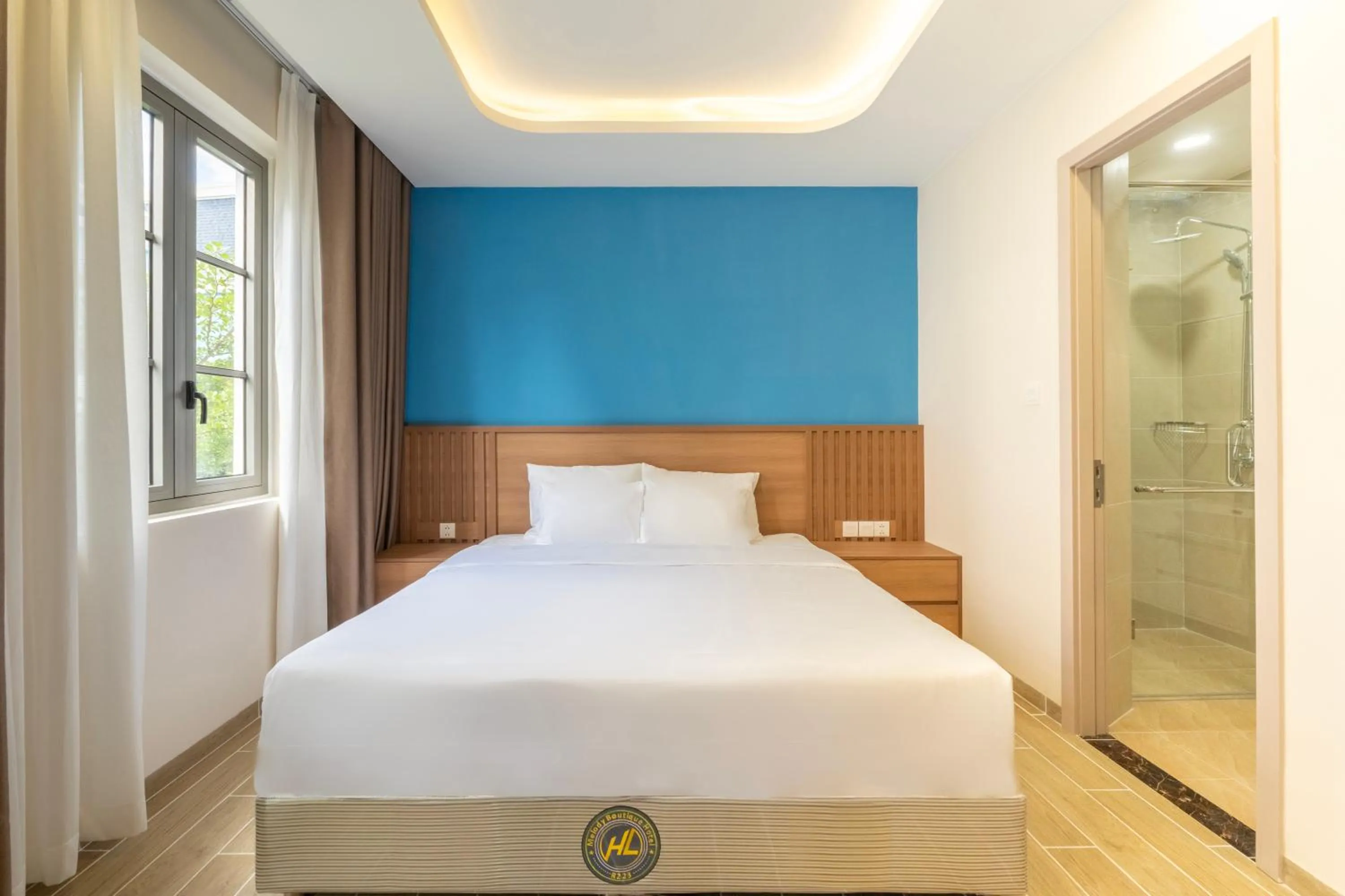 Bed in HL Melody Boutique Hotel