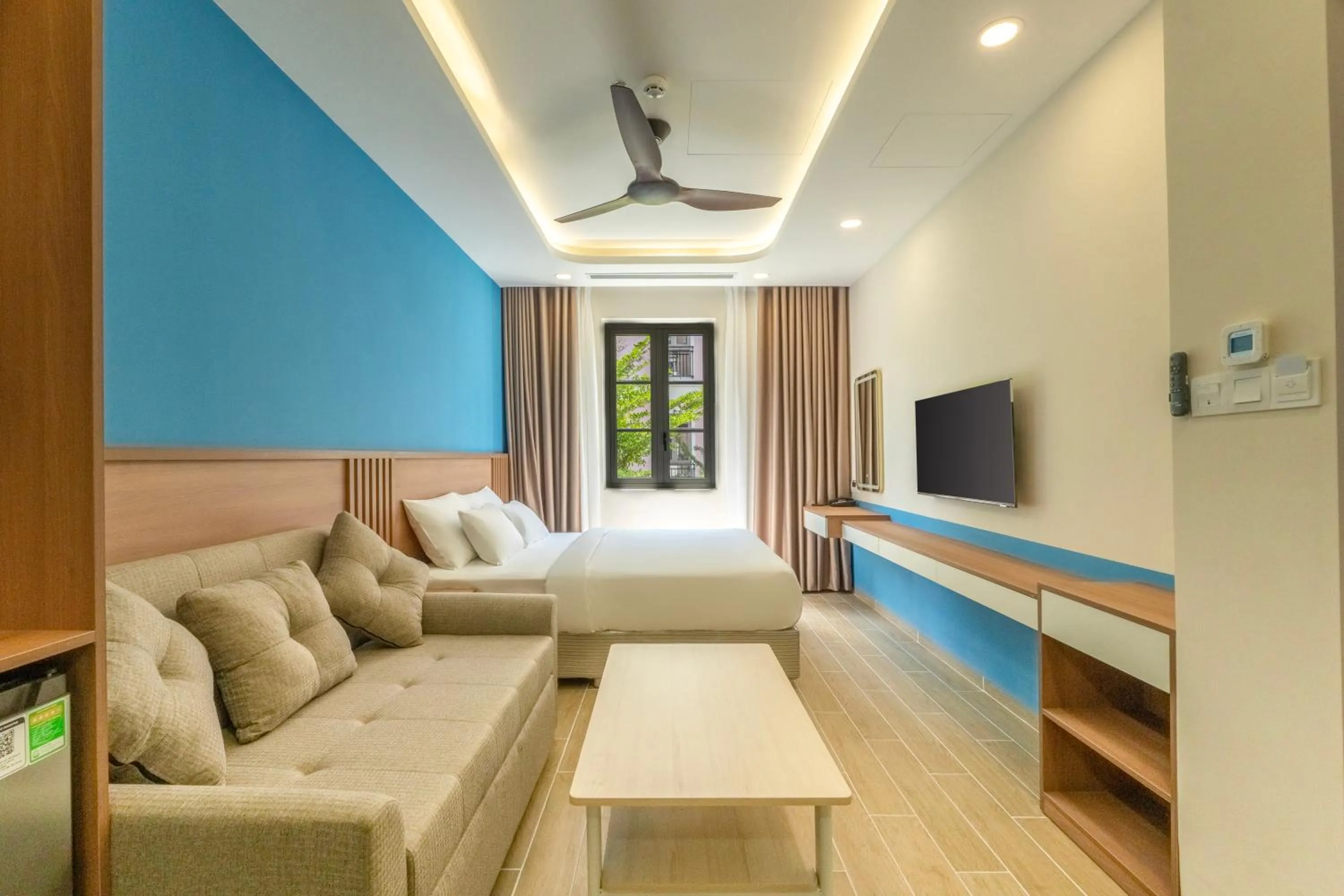 Communal lounge/ TV room in HL Melody Boutique Hotel