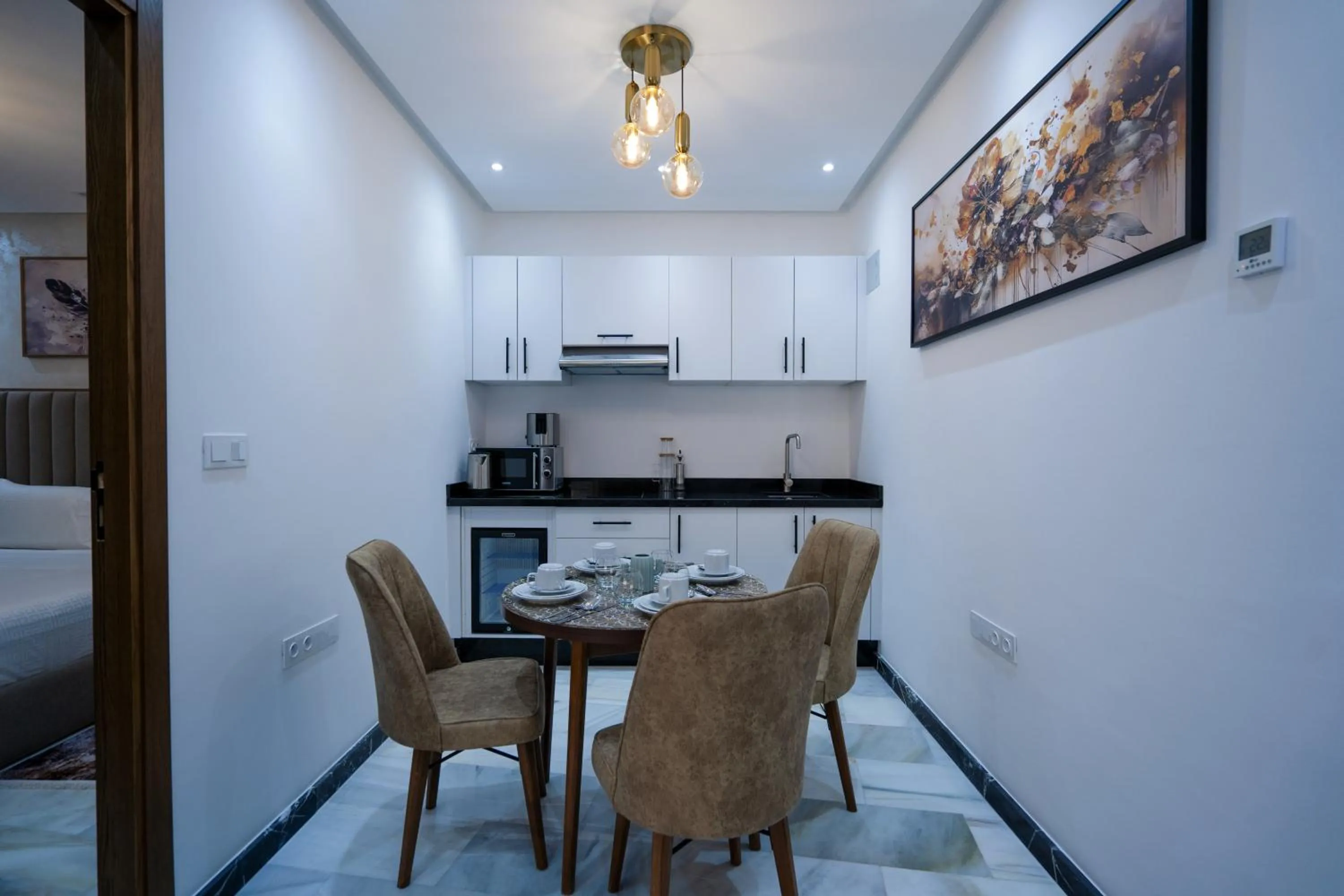 Kitchen or kitchenette in IMMOKA SUITEs